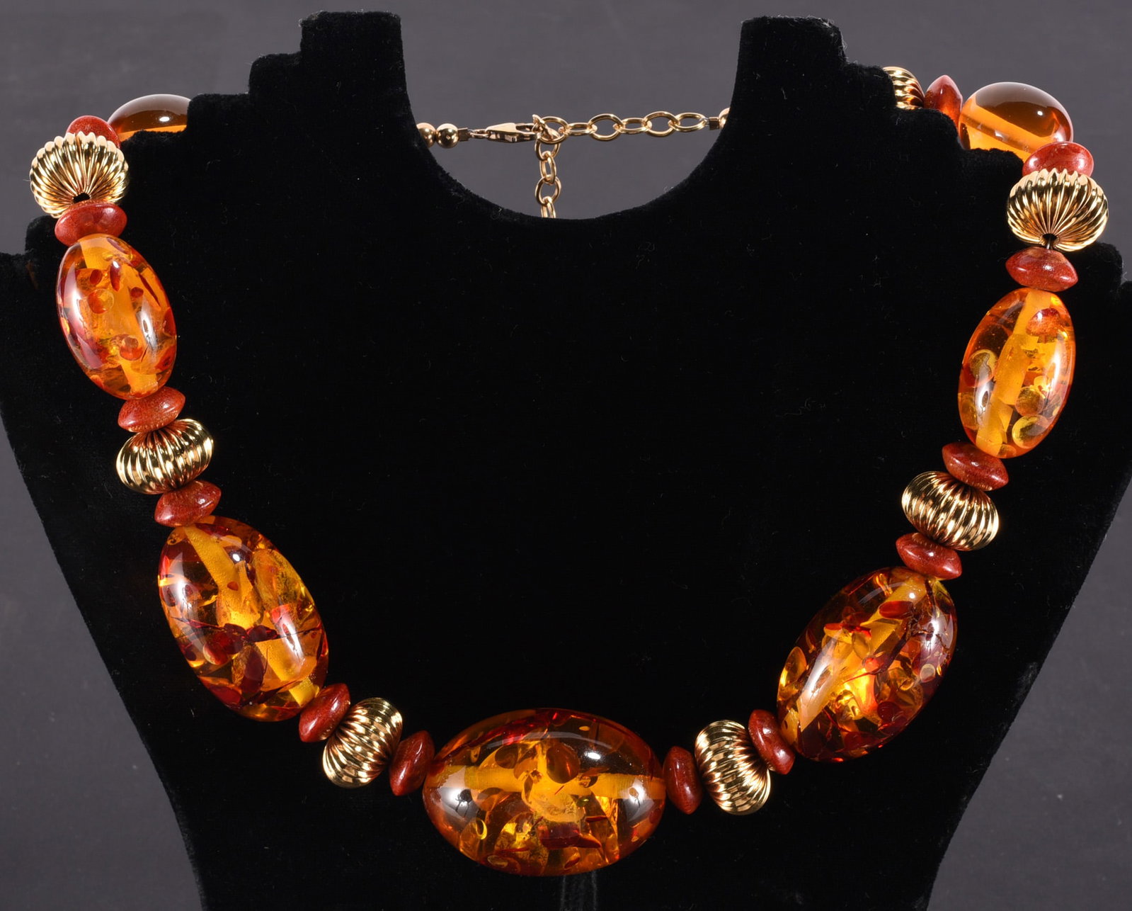 Huge formed amber oval beads with gold tone large spacers and coral spacers. Gold Fill clasp. 19" (1 of 2)