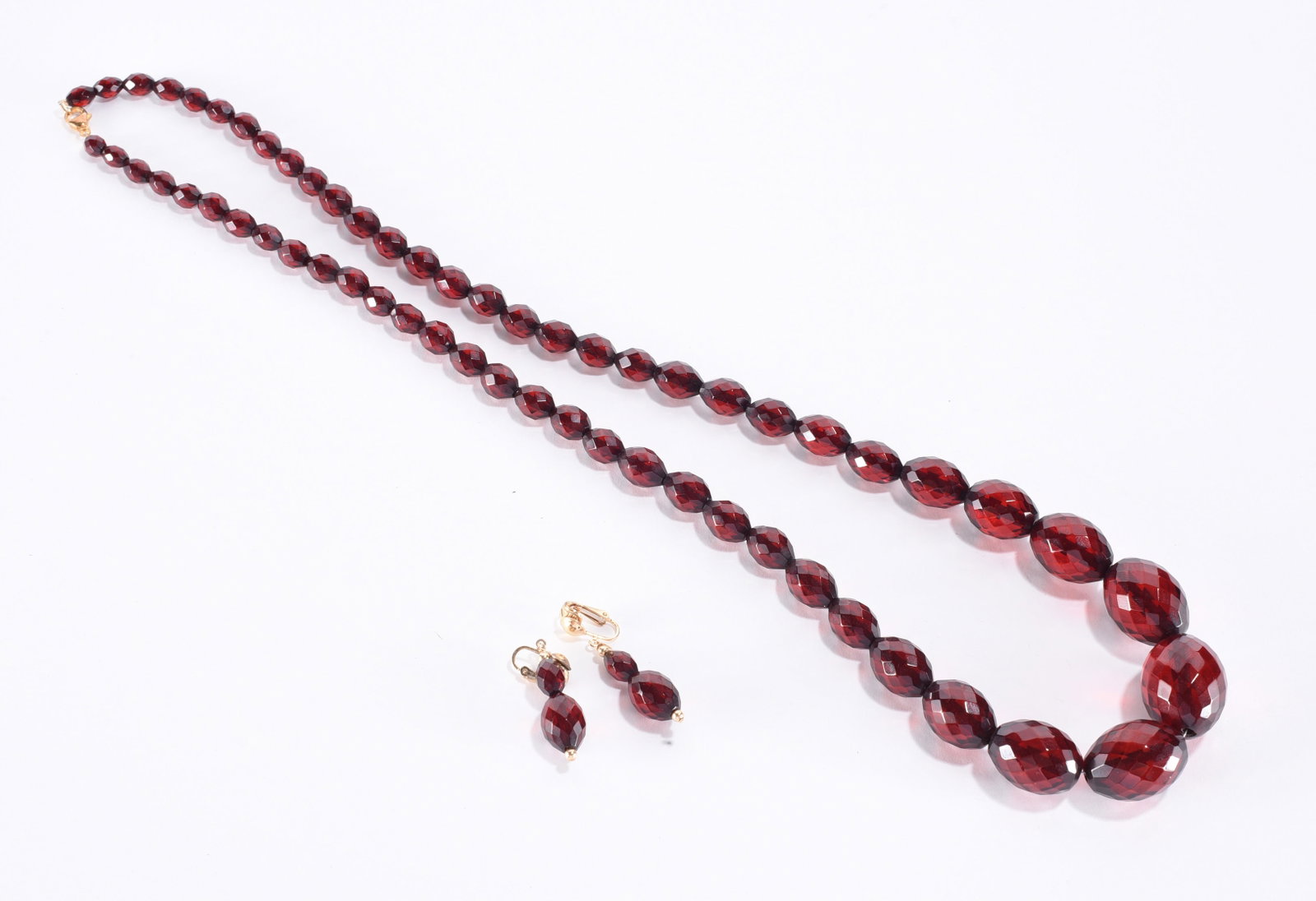 Faceted red cherry bakelite necklace - graduated Ring. Sizes with clip earrings. 28" (1 of 2)