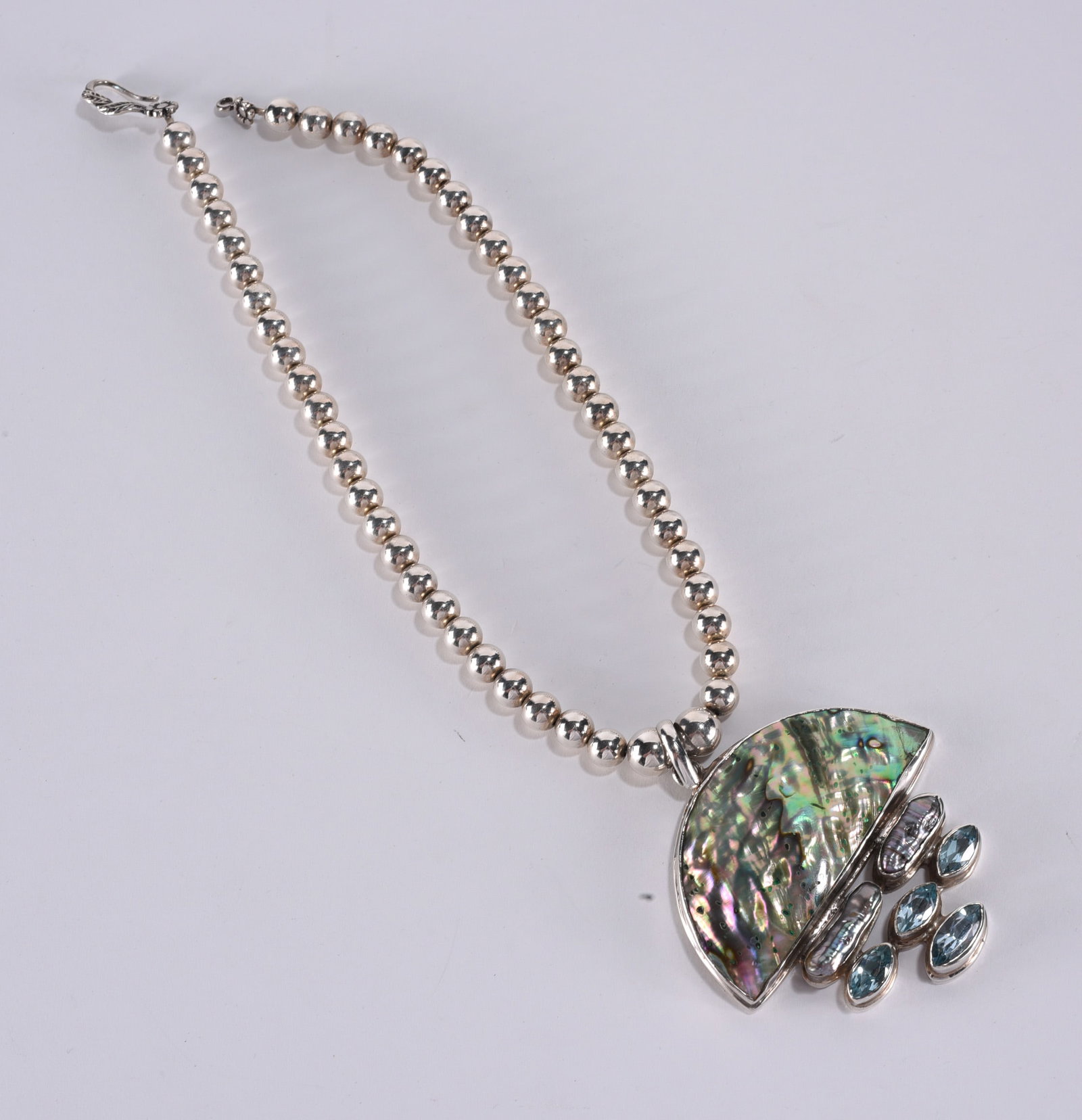 Artisan strung Sterling Silver necklace with abalone shell pendant pearls and swiss blue topaz gems. (1 of 3)