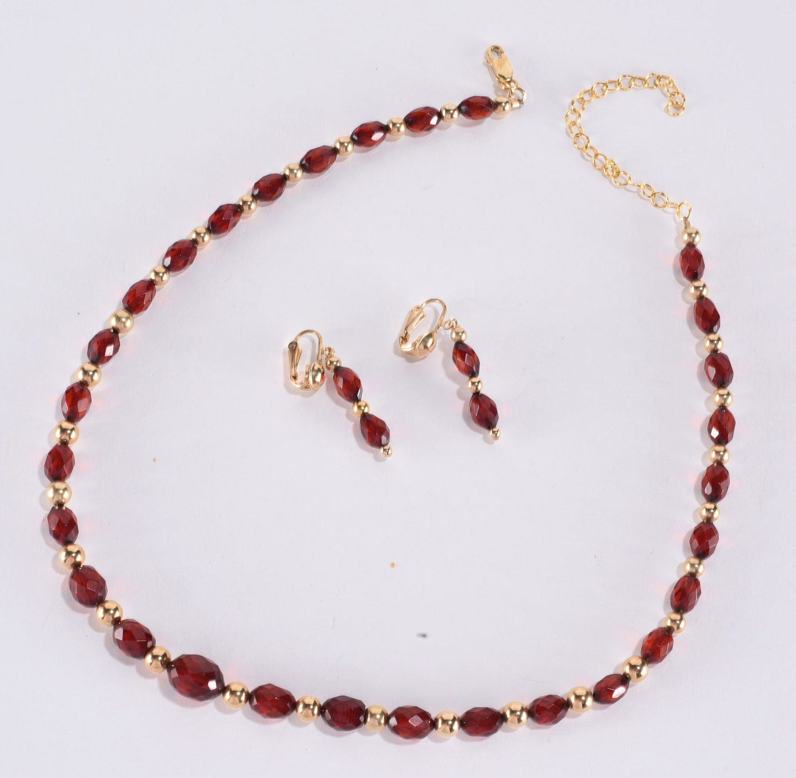 Graduated faceted cherry amber bakelite necklace with gold tone beads. Sterling Silver clasp. Gold (1 of 1)