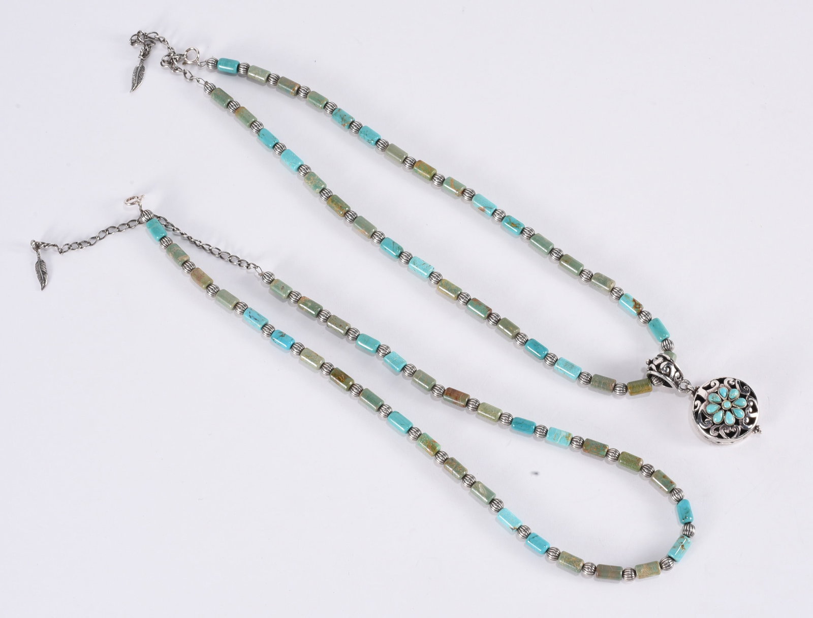 Turqoise agate barrel beaded necklace w/ silver spacers & Sterling Silver clasp . 17" ?plus;: Turqoise agate barrel beaded necklace w/ silver spacers & Sterling Silver clasp . 17" ?plus; Sterling Silver turqoise pendant on Sterling Silver turqoise barrel beaded necklace.