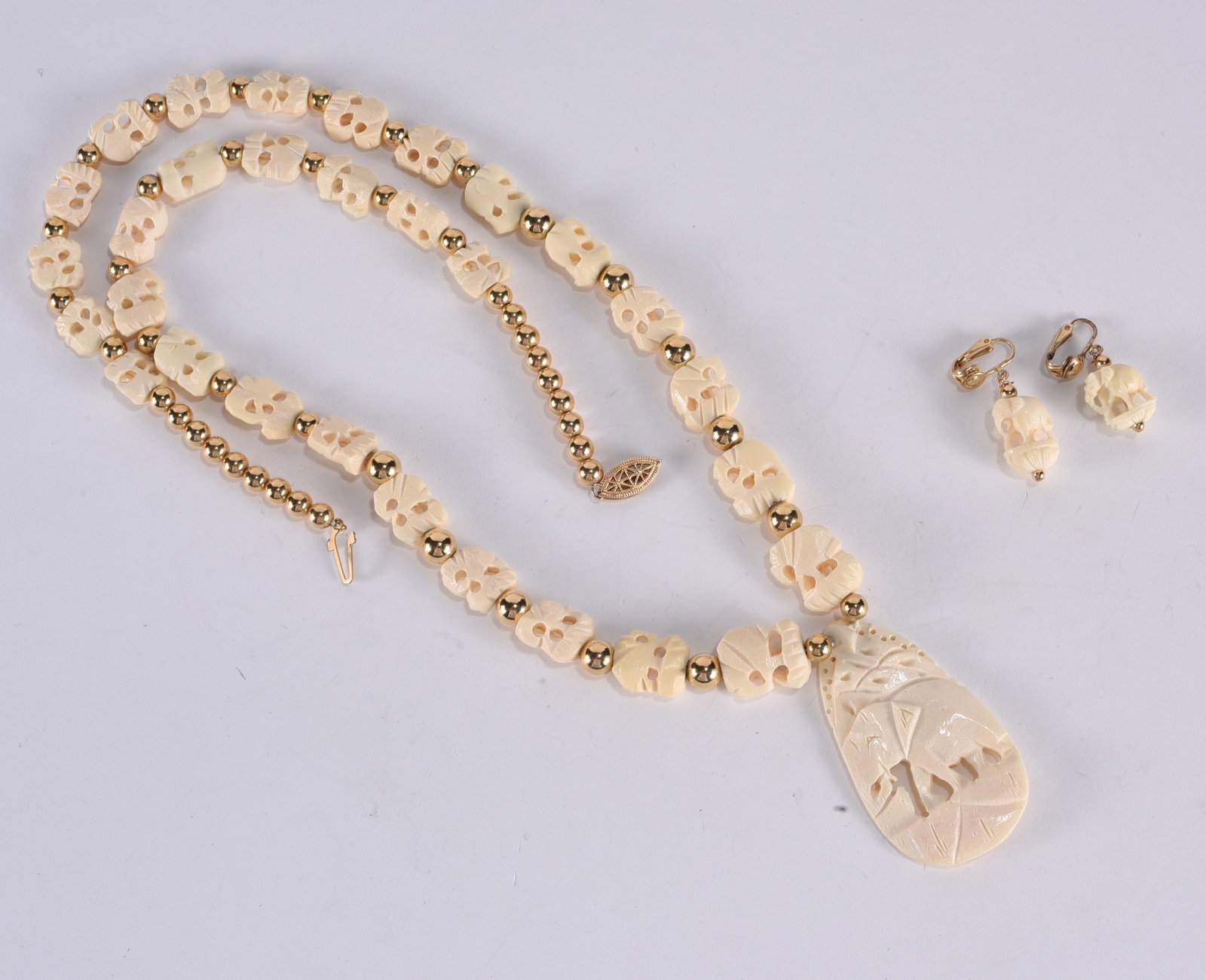 Carved bone elephant necklace with gold tone beads. Gold Fill clasp. 28" (1 of 1)