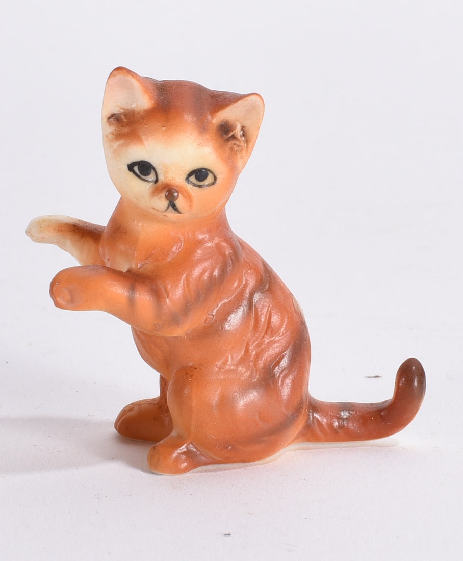 Standing Orange Tabby Cat Figurine: Vintage ceramic orange tabby cat figurine modeled standing upright with raised paws and painted facial details.