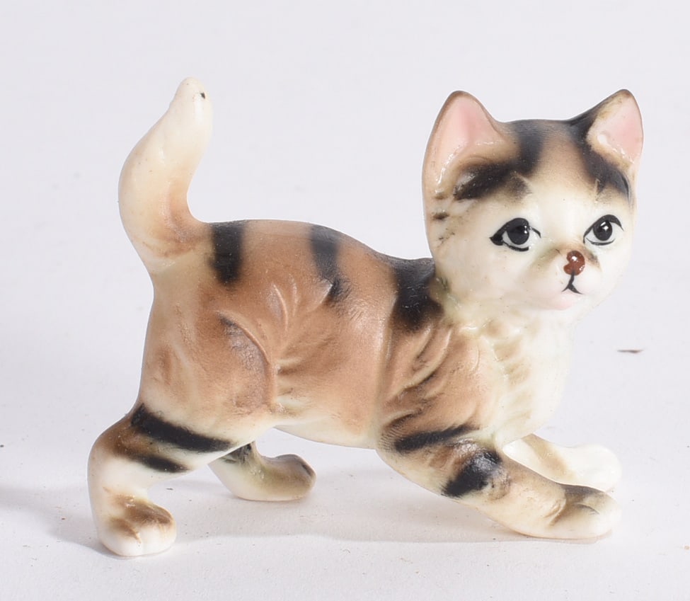 Walking Calico Cat Figurine: Vintage ceramic calico cat figurine in walking pose with hand-painted striped decoration and raised tail.