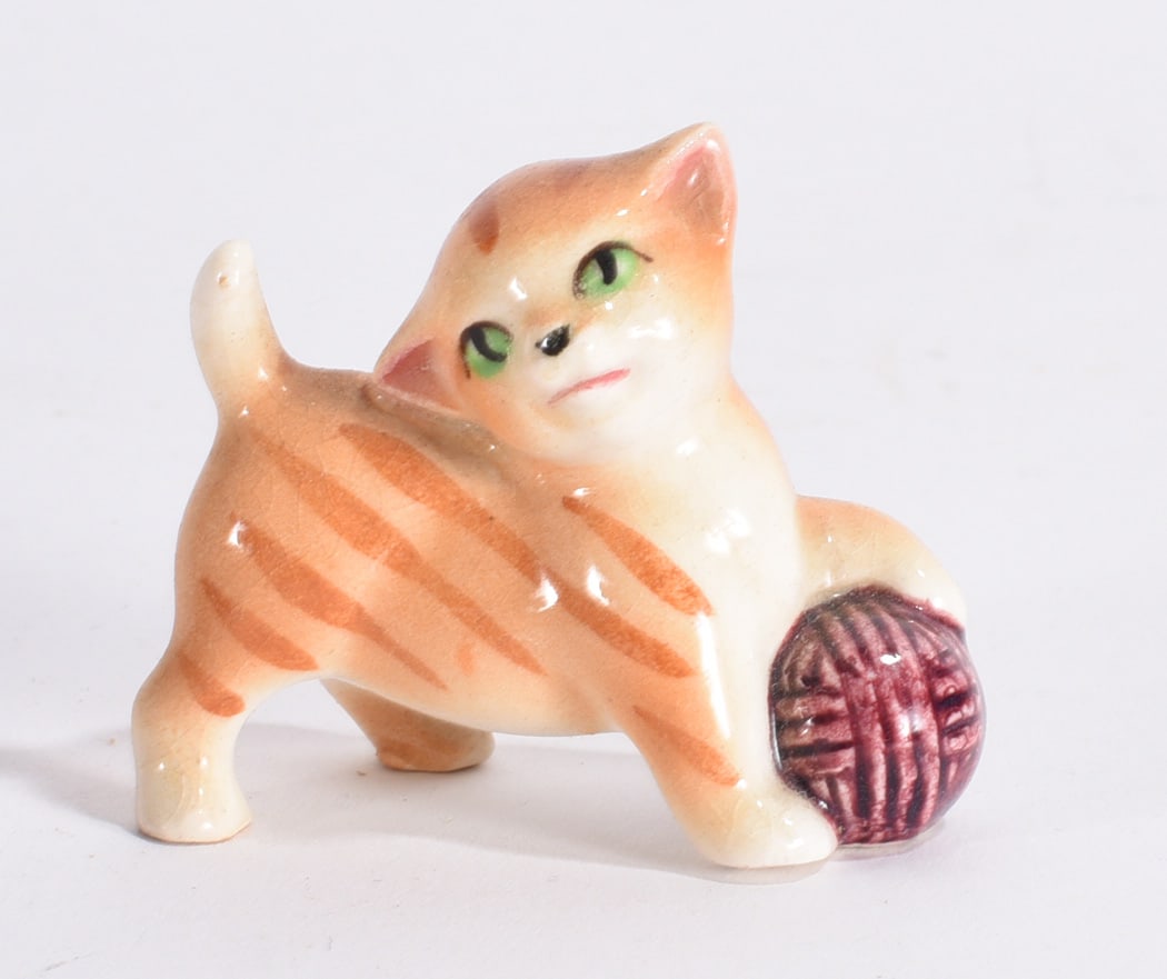 Cat with Yarn Ball Ceramic Figurine: Vintage orange striped ceramic kitten figurine posed beside a purple yarn ball with painted green eyes.