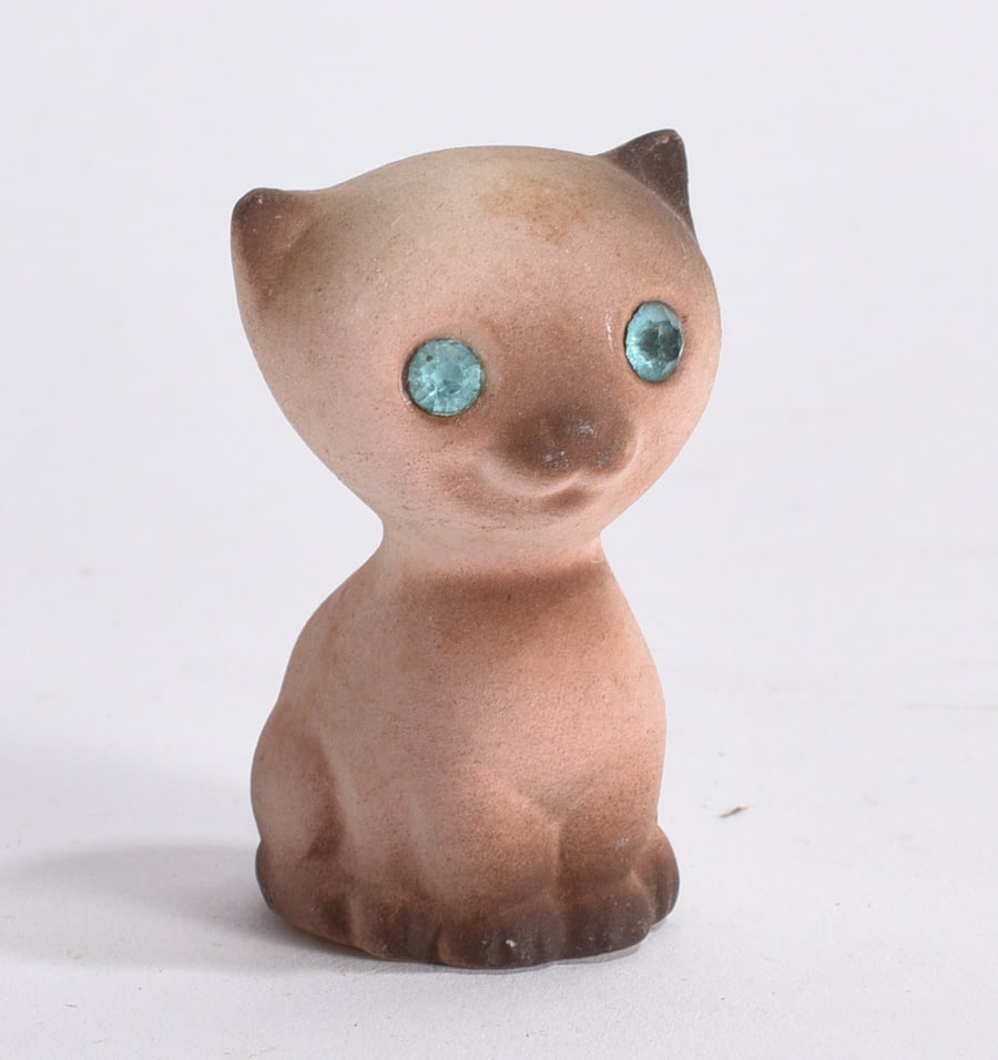 Blue Rhinestone Eye Cat Figurine: Stylized ceramic cat figurine featuring blue rhinestone eyes and matte glazed finish.