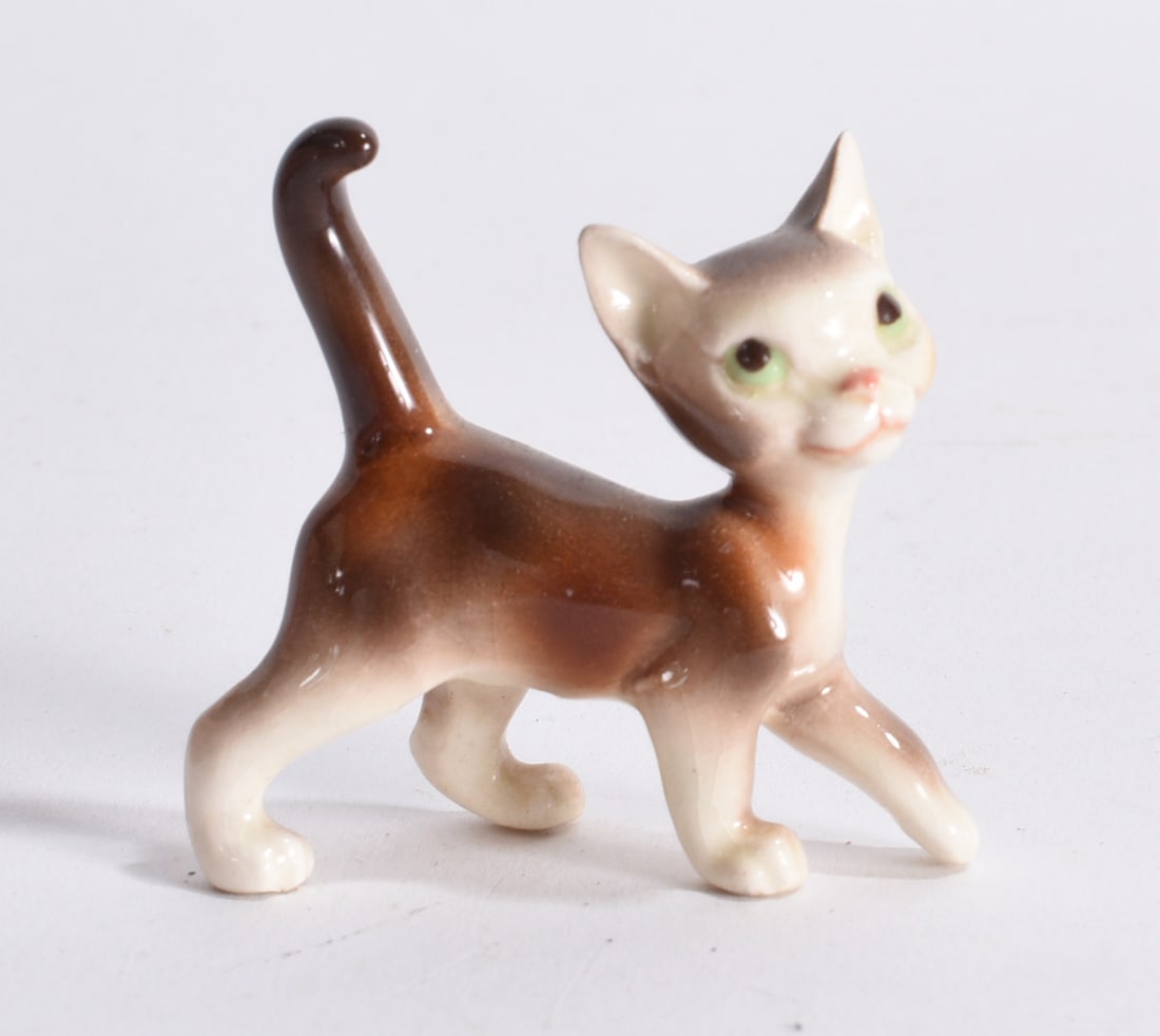 Brown and White Walking Cat Figurine: Vintage ceramic cat figurine in walking pose with brown and cream glaze and painted green eyes.