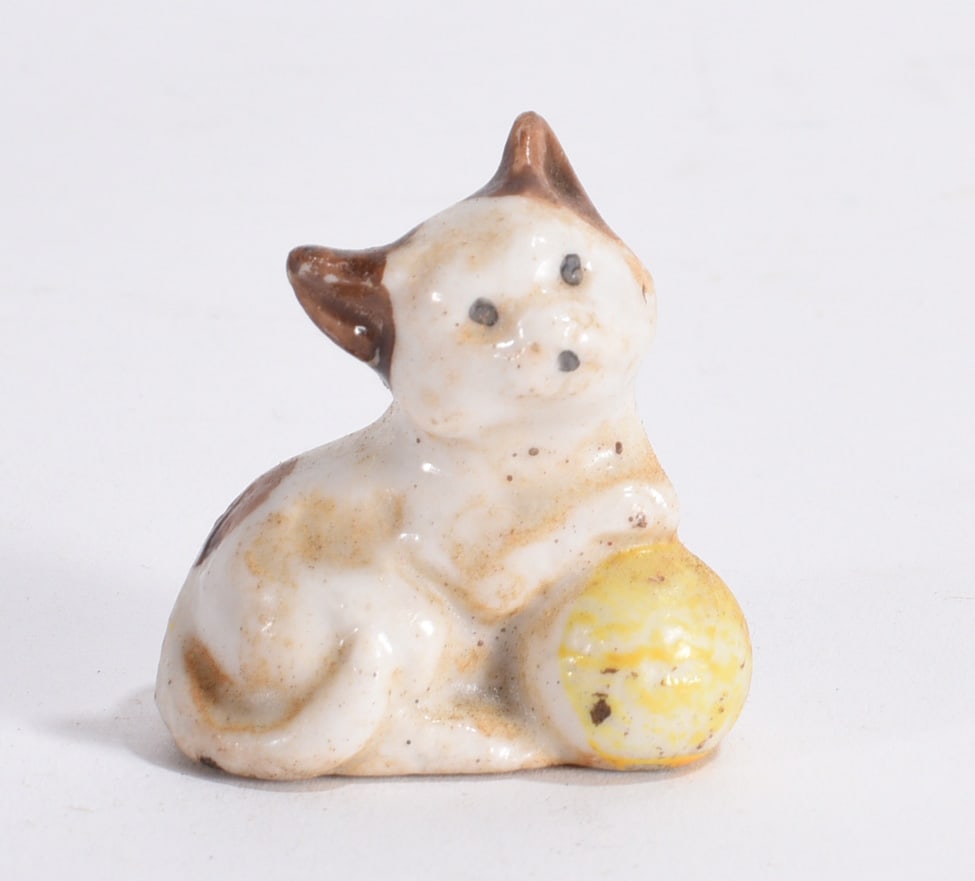 Cat with Yellow Ball Figurine: Vintage ceramic kitten figurine posed beside a yellow ball with hand-painted accents and worn glaze.
