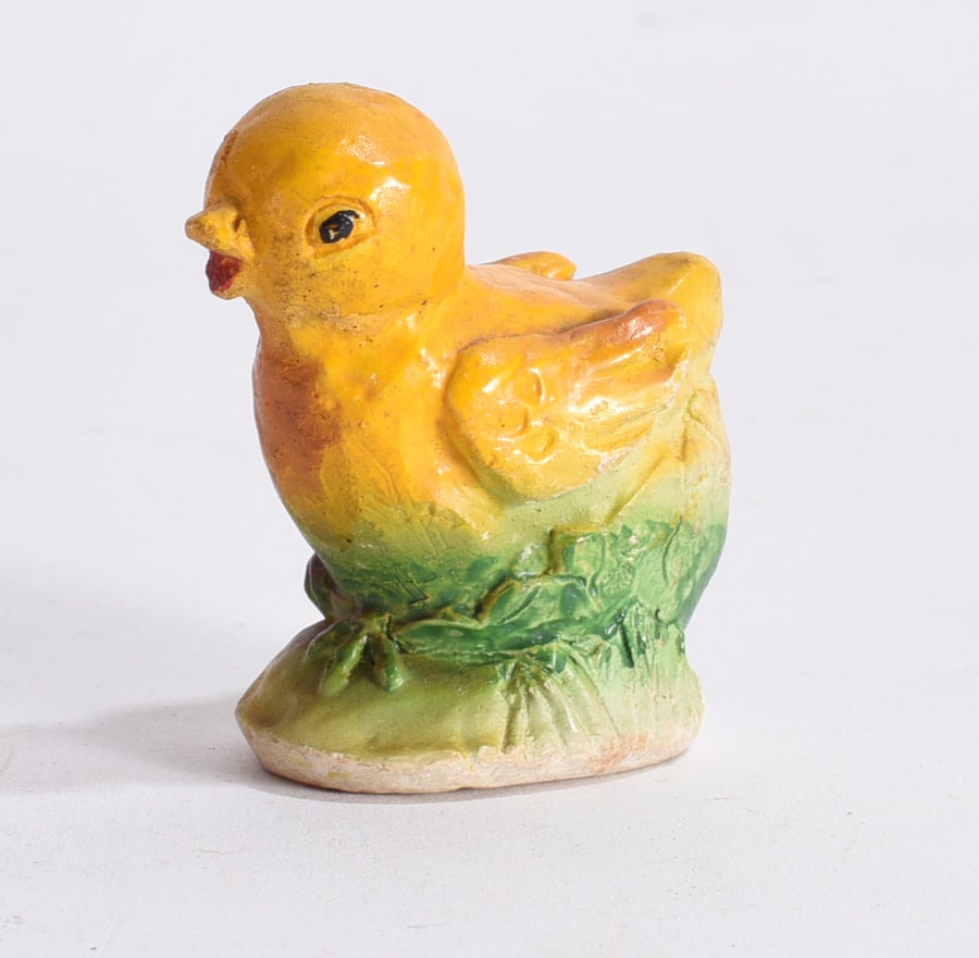 Yellow Chick Figurine: Vintage yellow chick figurine standing on grassy base with molded feather detail and painted features.