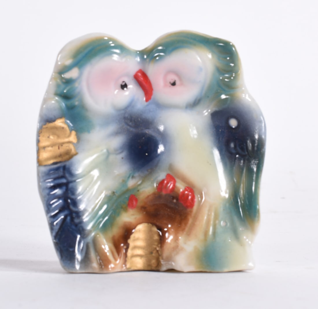 Colorful Owl Figurine: Whimsical multicolor owl figurine with exaggerated eyes and hand-painted details.