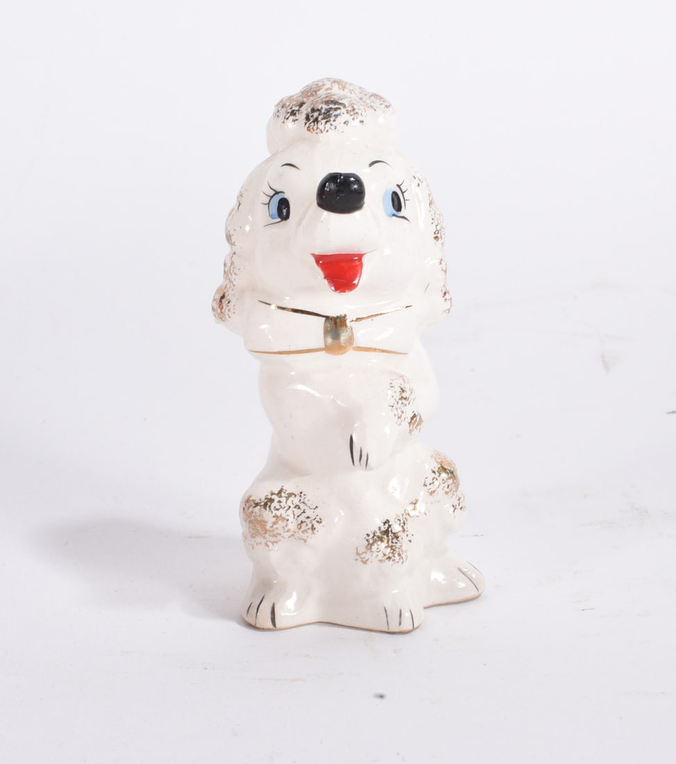 White Poodle Figurine: Whimsical white ceramic poodle figurine with painted facial features and gold accent highlights.