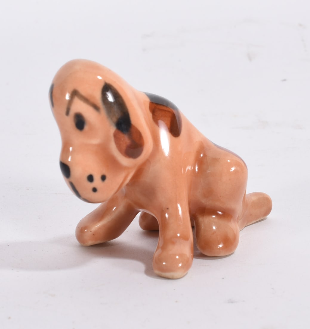 Orange Hound Dog Figurine: Glossy orange ceramic hound dog figurine in seated pose with floppy ears and black painted spots.