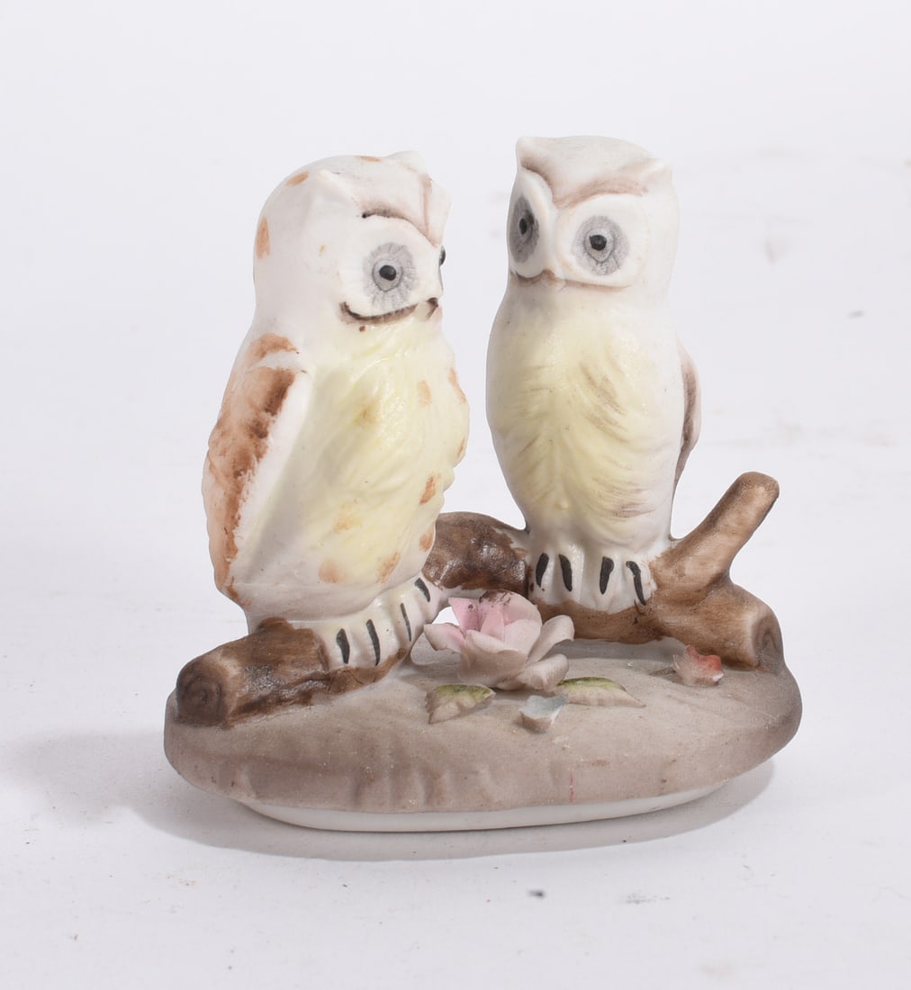 Pair of Owl Figurines: Miniature terrier dog figurine with black and cream painted decoration and seated pose.