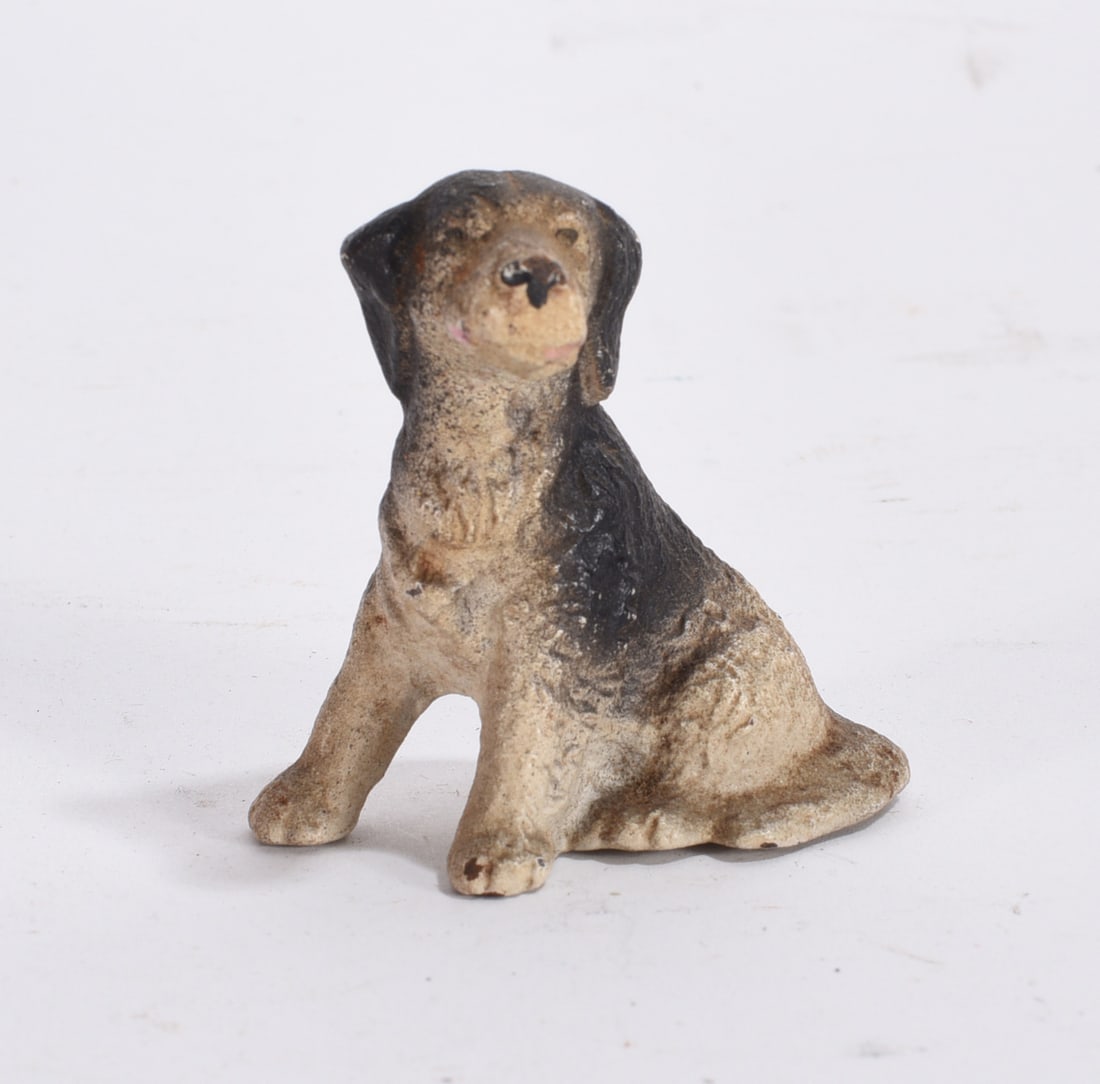 Miniature Sitting Dog Figurine: Bronze finish spaniel dog figurine modeled standing with detailed textured coat.