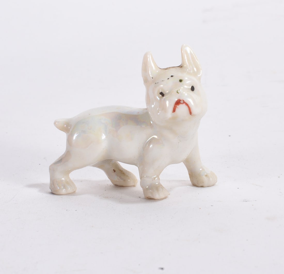 French Bulldog Figurine: White glazed ceramic French bulldog figurine with upright ears and expressive face.