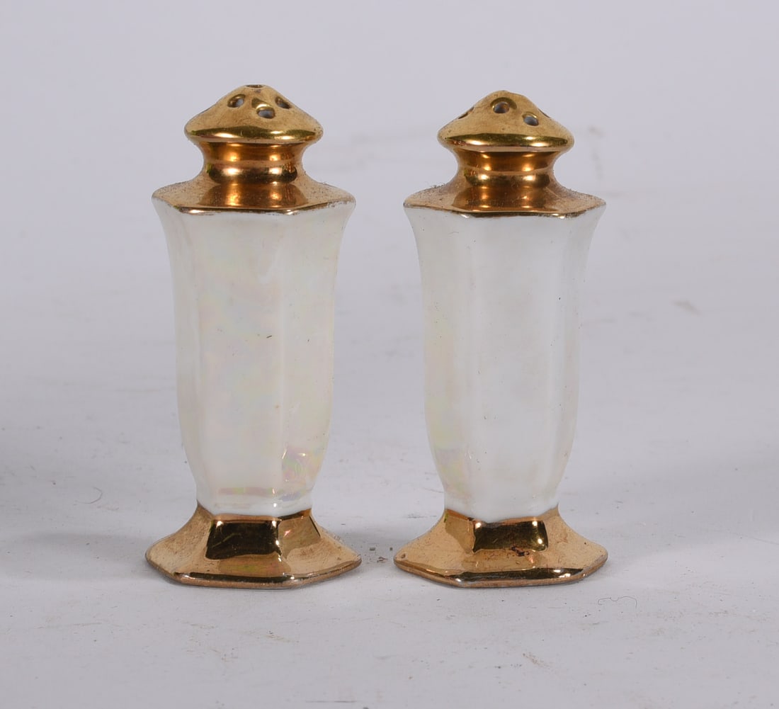 Iridescent Porcelain Salt and Pepper Shakers: Pair of iridescent porcelain salt and pepper shakers with gilt metal tops and trim.