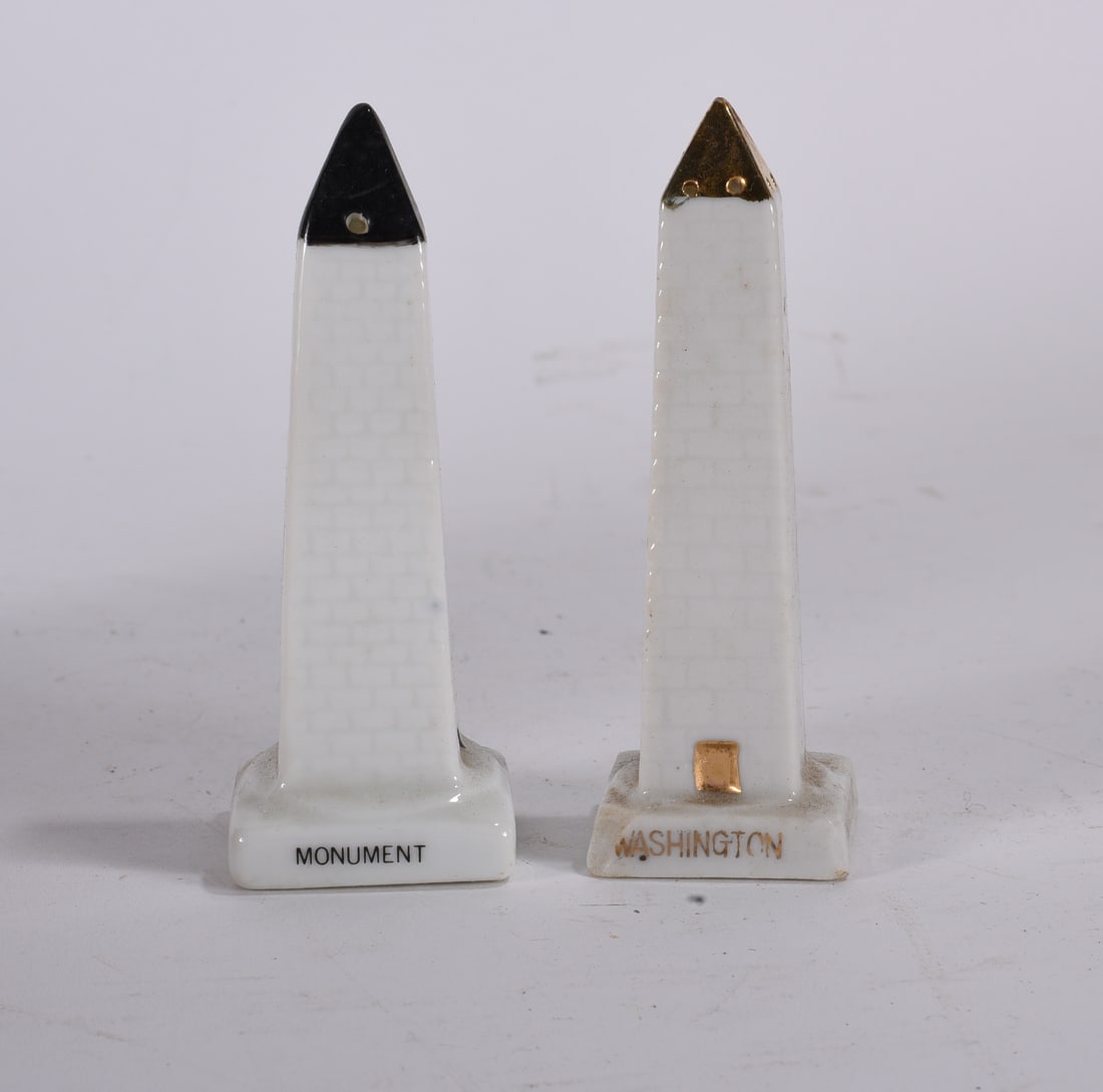Washington Monument Souvenir Salt and Pepper Shakers: Pair of porcelain Washington Monument souvenir salt and pepper shakers with black and gilt accents.
