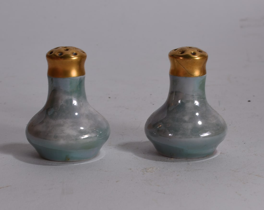 Blue Spongeware Pottery Salt and Pepper Shakers: Pair of blue spongeware style pottery salt and pepper shakers with bulbous form.