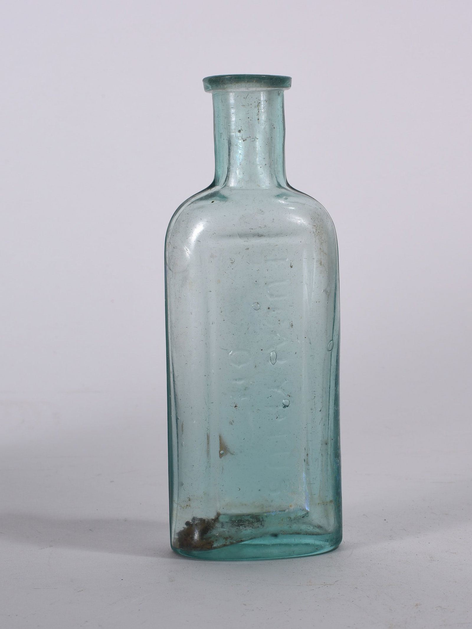 Aqua Blob Top Utility Bottle: Early hand-blown aqua glass bottle with blob top finish and tapered shoulder. Showing iridescence and mineral deposits from age.