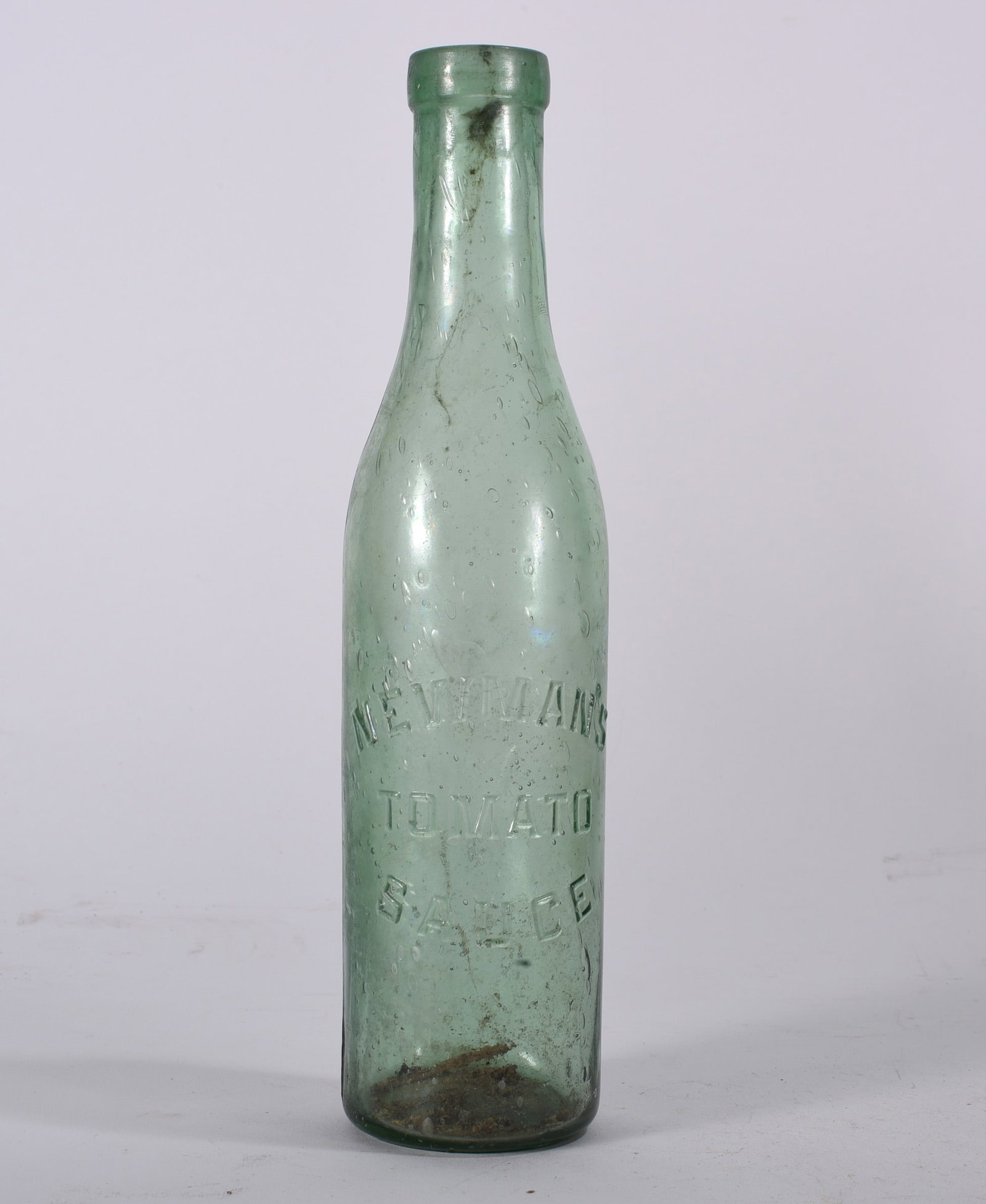 Antique Bottles: Green aqua condiment bottle embossed ?TOMATO SAUCE? to body. Tall narrow form with interior residue and light haze.