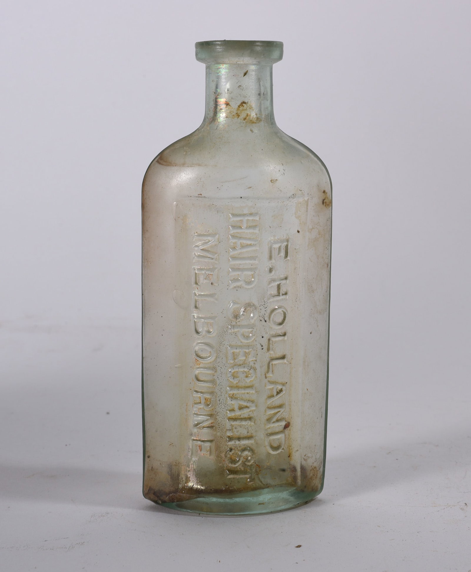 Antique Bottles: Antique aqua poison bottle embossed ?AMMONIA NOT TO BE TAKEN.? Rounded shoulder form with heavy embossing and interior residue.