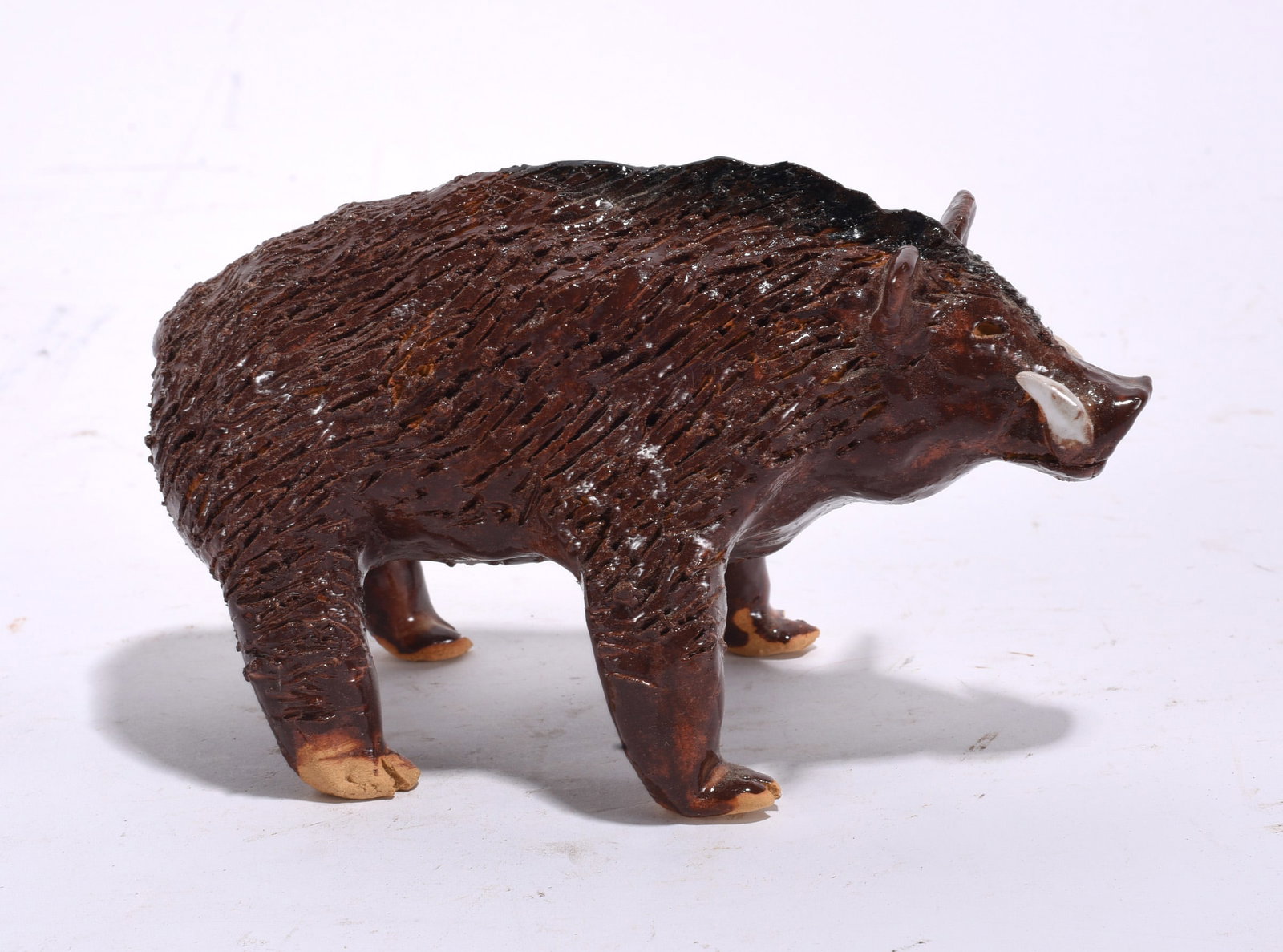 Lynn Bailey Pottery Warthog: Lynn Bailey Pottery Warthog 4" high, 7" long All of the Marvin Bailey pottery is in mint condition. In house shipping may very between $56 and $72 per box.
