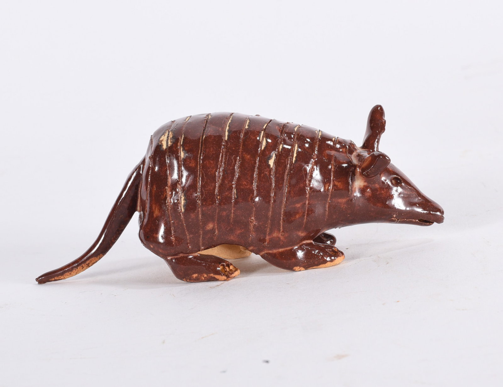 Lynn Bailey Pottery Armadilo: Lynn Bailey Pottery Armadilo 2"x5" All of the Marvin Bailey pottery is in mint condition. In house shipping may very between $56 and $72 per box.