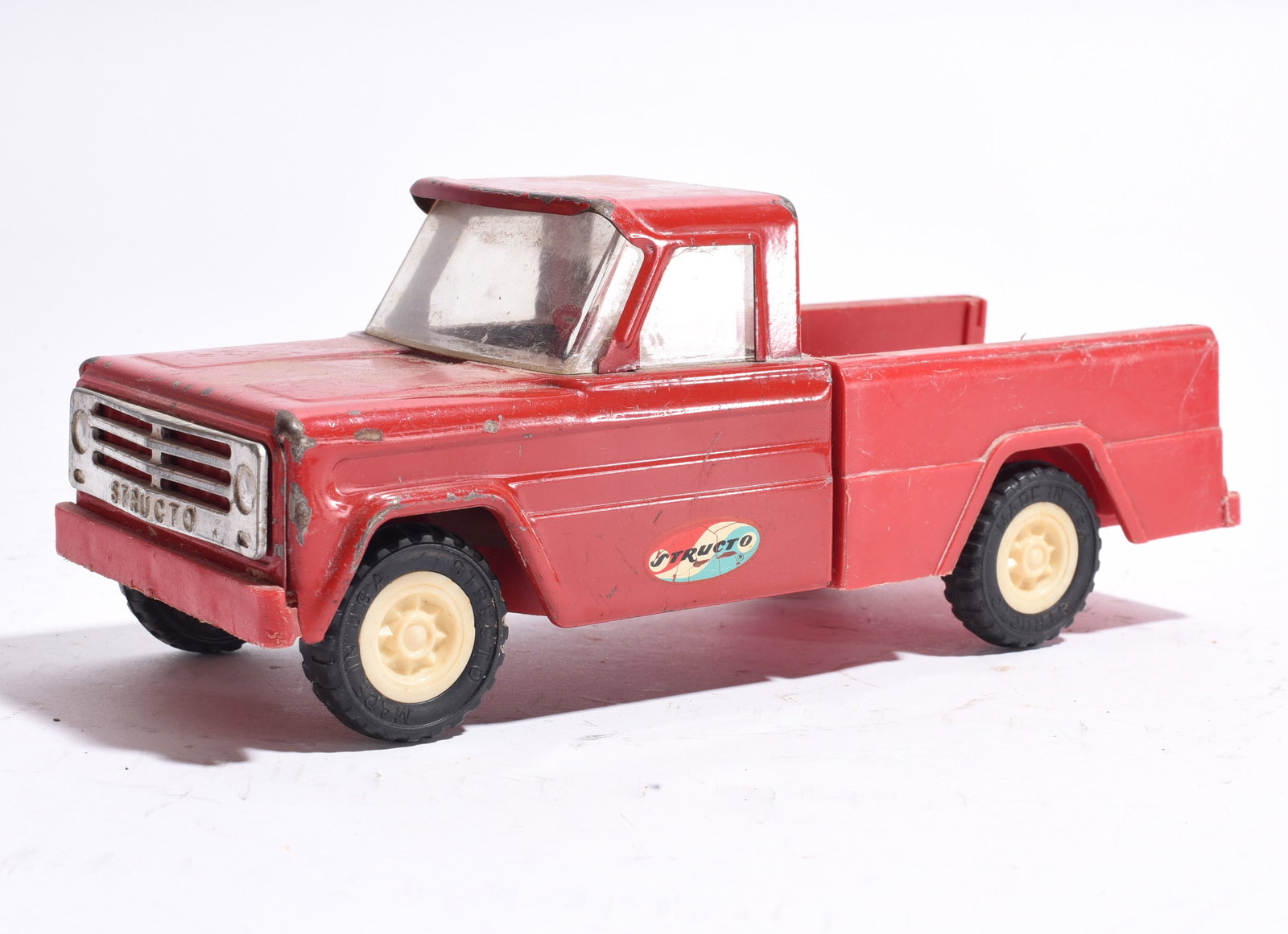 Structo Pickup Truck in Blue & White Finish: Structo pickup truck in metallic blue and white finish with sliding rear tailgate detail. Displays moderate wear and handling marks.