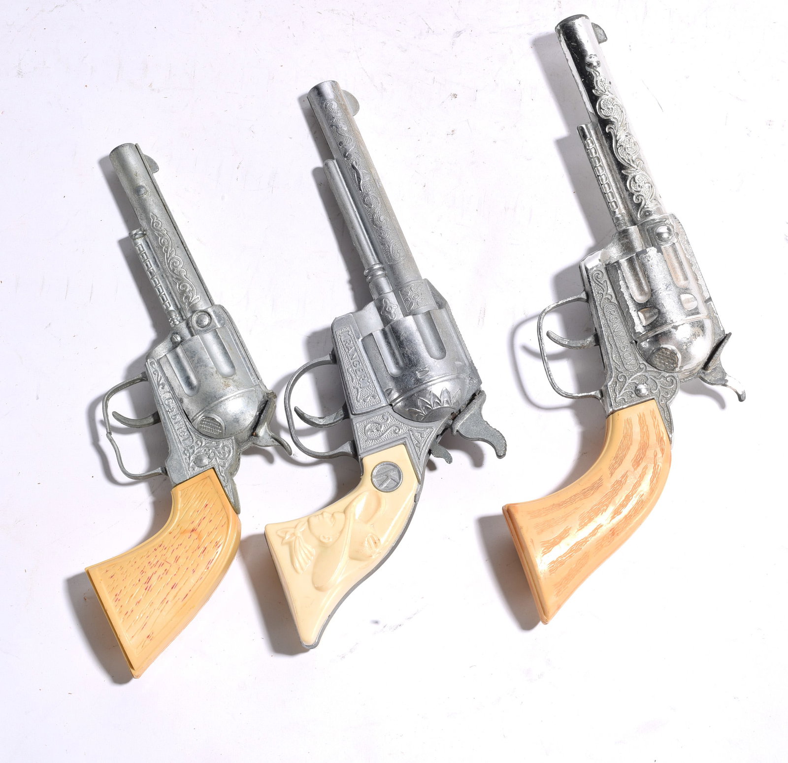 Group of Three Cast Metal Toy Revolvers (1 of 2)