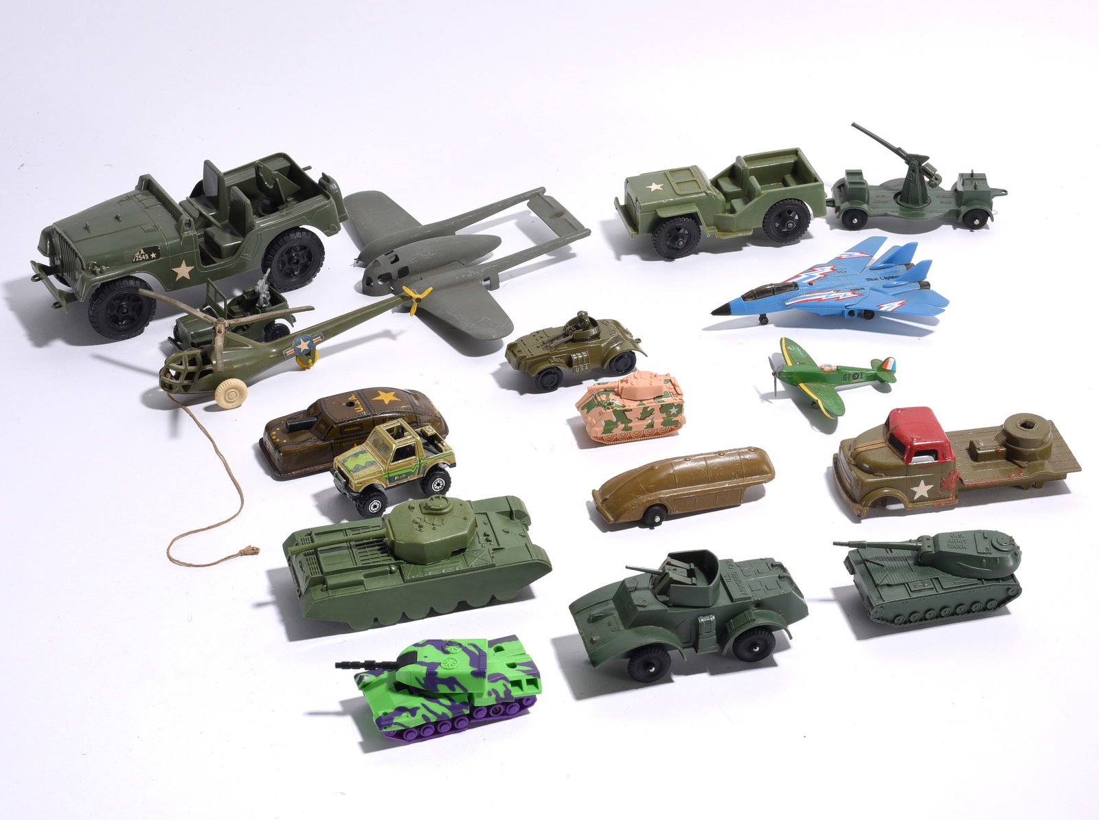 Military Toy Vehicle and Aircraft Collection: Collection of military-themed toy vehicles and aircraft including jeeps, tanks, armored cars, airplanes, helicopters, artillery units, and transport vehicles. Mixed scales and manufacturers with play