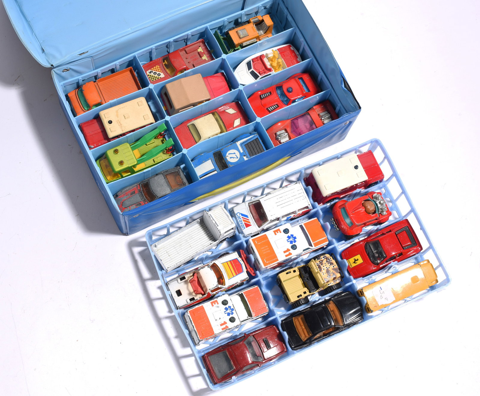 Die-Cast Vehicle Collection in Storage Case: Collection of die-cast and toy vehicles stored in compartment organizer case. Includes emergency vehicles, sports cars, trucks, construction equipment, and utility vehicles by various makers.
