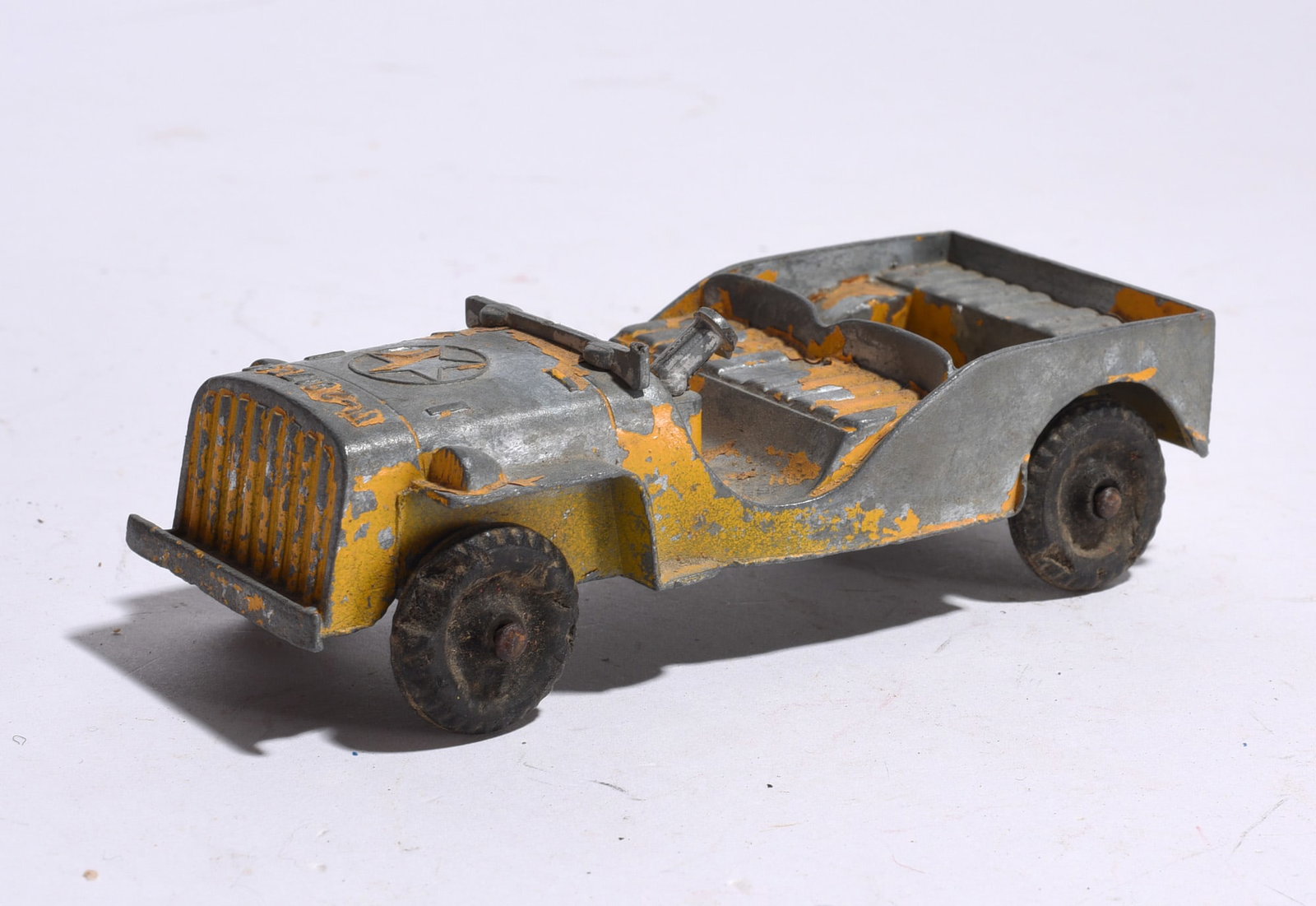Pressed Steel Tractor Cab: Pressed steel tractor cab in green and silver painted finish. Surface wear, paint loss, and oxidation throughout. Suitable for restoration or display.