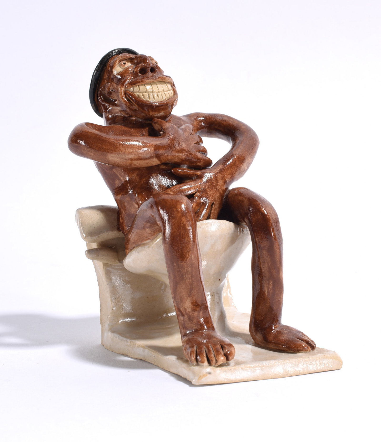Stacy Lambert Folk Pottery Figure: early pottery figure of black man sitting on toilet. Ca. 1996. 5"