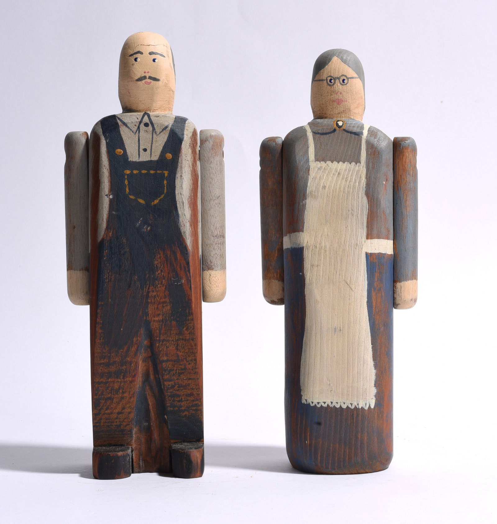 Wolf Creek Carved Wooden Sculptures: carved wood and paint, signed on bottom. Both are 10"