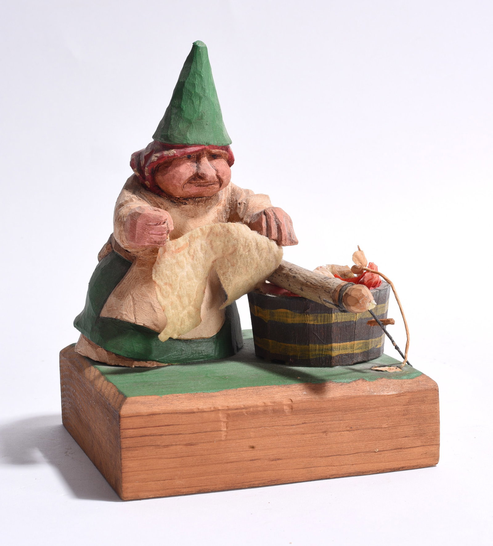 Carved Wooden Figure: carved wooden figure on base. 5" x 7"