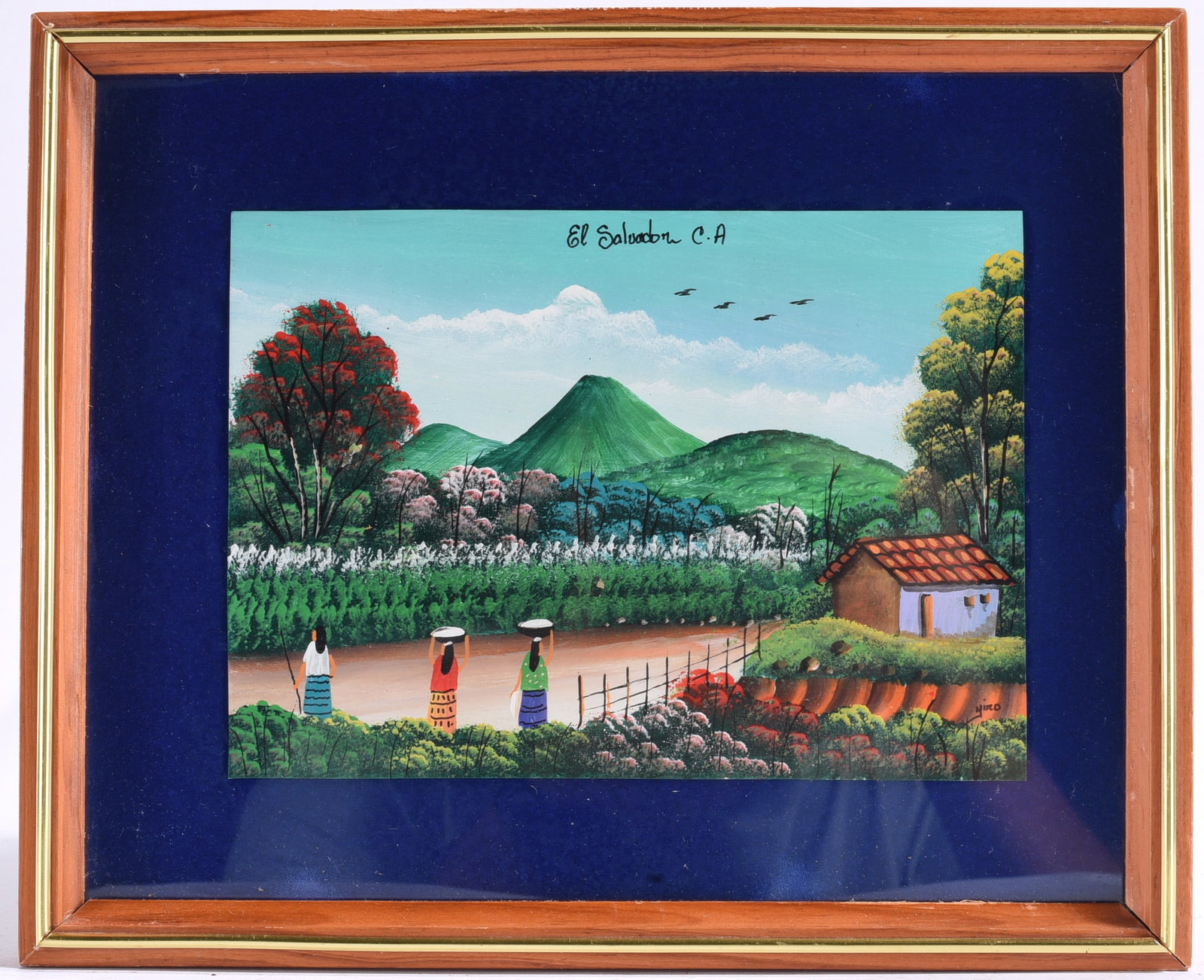 El Salvador C.A. Folk Art Landscape Print: 11"x9" Framed folk art painting depicting a colorful rural landscape in El Salvador with a volcano, village, and figures carrying baskets. Signed lower right and titled "El Salvador C.A."