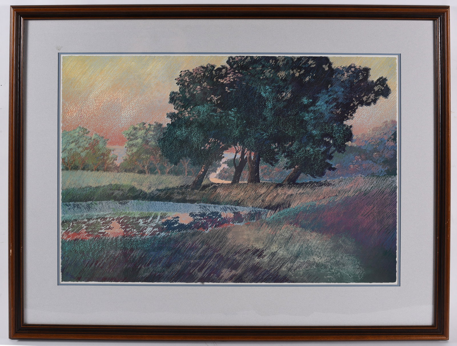 Framed Impressionist Style Landscape Art Print: 40"x31" Decorative landscape print rendered in an impressionistic style with a tranquil pond reflecting a grove of trees at sunset. Matted and framed under glass in a wood frame, ideal for traditional