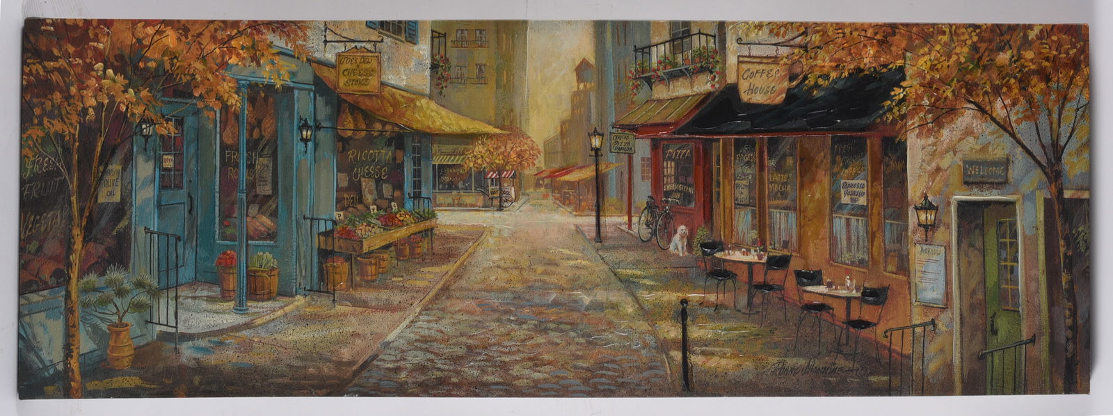 Autumn European Street Scene Canvas Print: 48"x15.5" Panoramic canvas print depicting a charming European street lined with caf?s, markets, and shops beneath colorful autumn trees. Ready to display with warm Old World character.