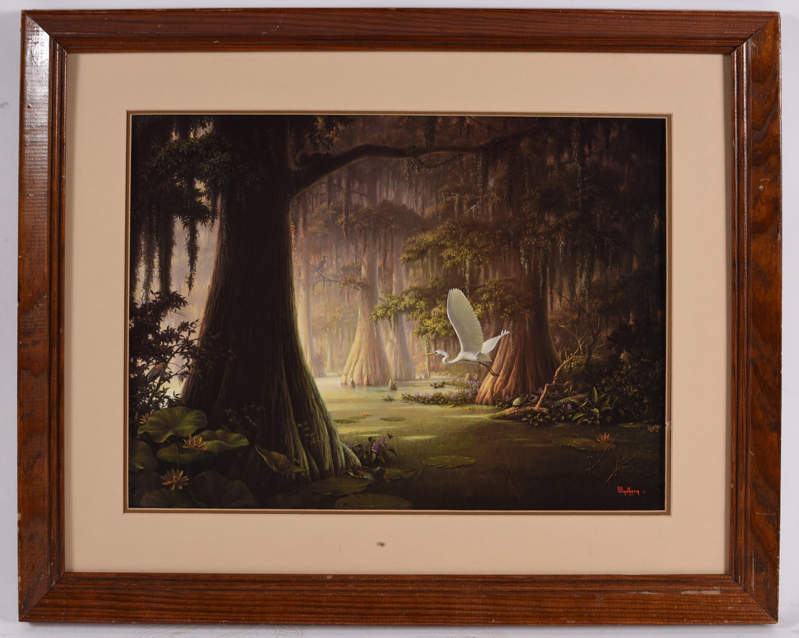 Framed Cypress Swamp Landscape Print: 22"x18" Landscape print depicting a tranquil cypress swamp with towering trees, Spanish moss, and a white egret in flight. Matted and framed under glass in a wood frame, creating a peaceful Southern w