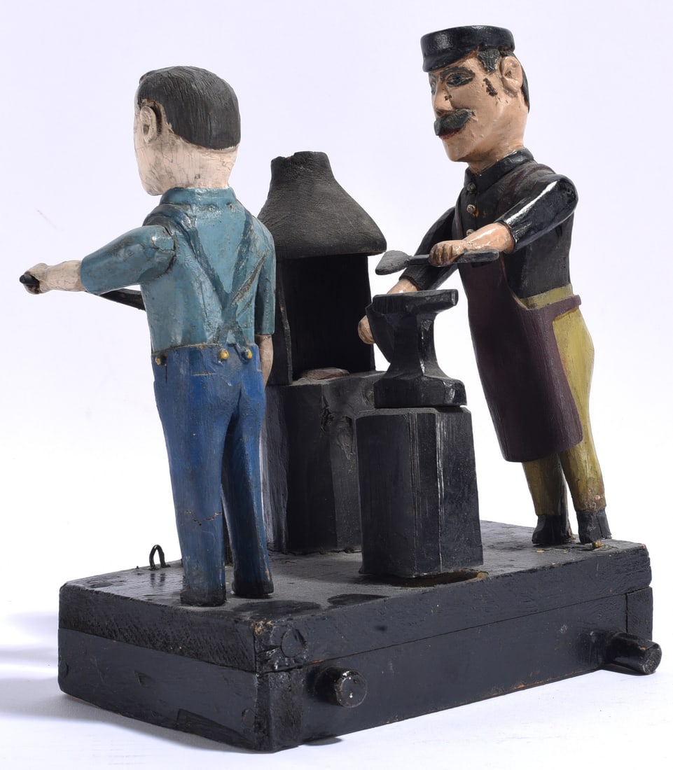 Outstanding Blacksmith Folk Art Wood Carving: 8"x9" Unidentified folk artist carved and painted wood blacksmith shop scene depicting two working figures with an anvil, forge, tools, and related equipment. Constructed as a three-dimensional narrat