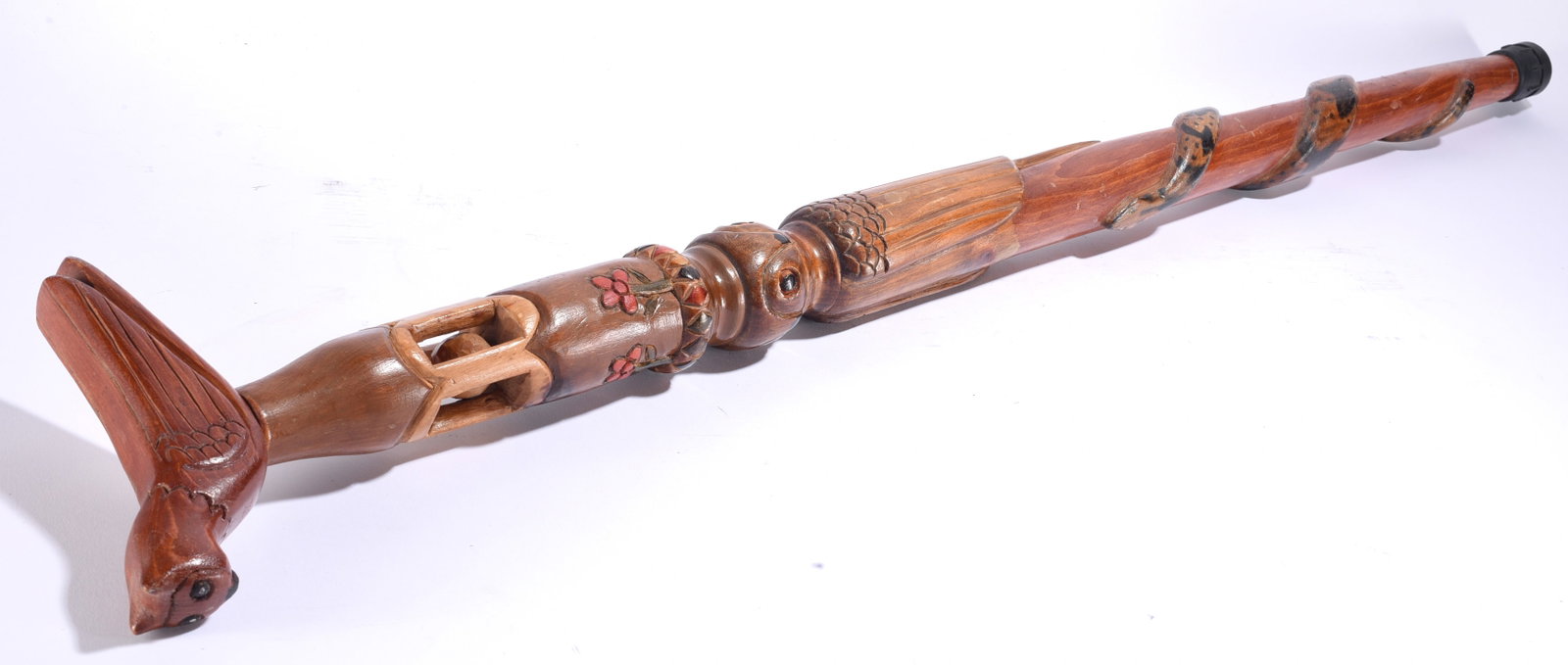 Golman Crabtree Folk Art Carved Cane: 43" Golman Crabtree folk art carved cane featuring extensive relief and openwork carving with a bird-form handle, floral decoration, geometric elements and a winding snake along the shaft. An unusuall