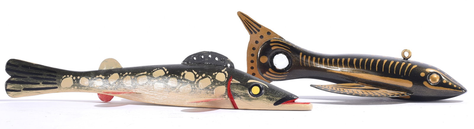 Ron Jackson Carved Fish Decoy and other: Largest is 10.5" x 2" Two carved and painted wooden fish decoys by Ron Jackson, featuring elongated predatory fish forms with glass eyes, applied fins and highly decorative painted surfaces. One is fi