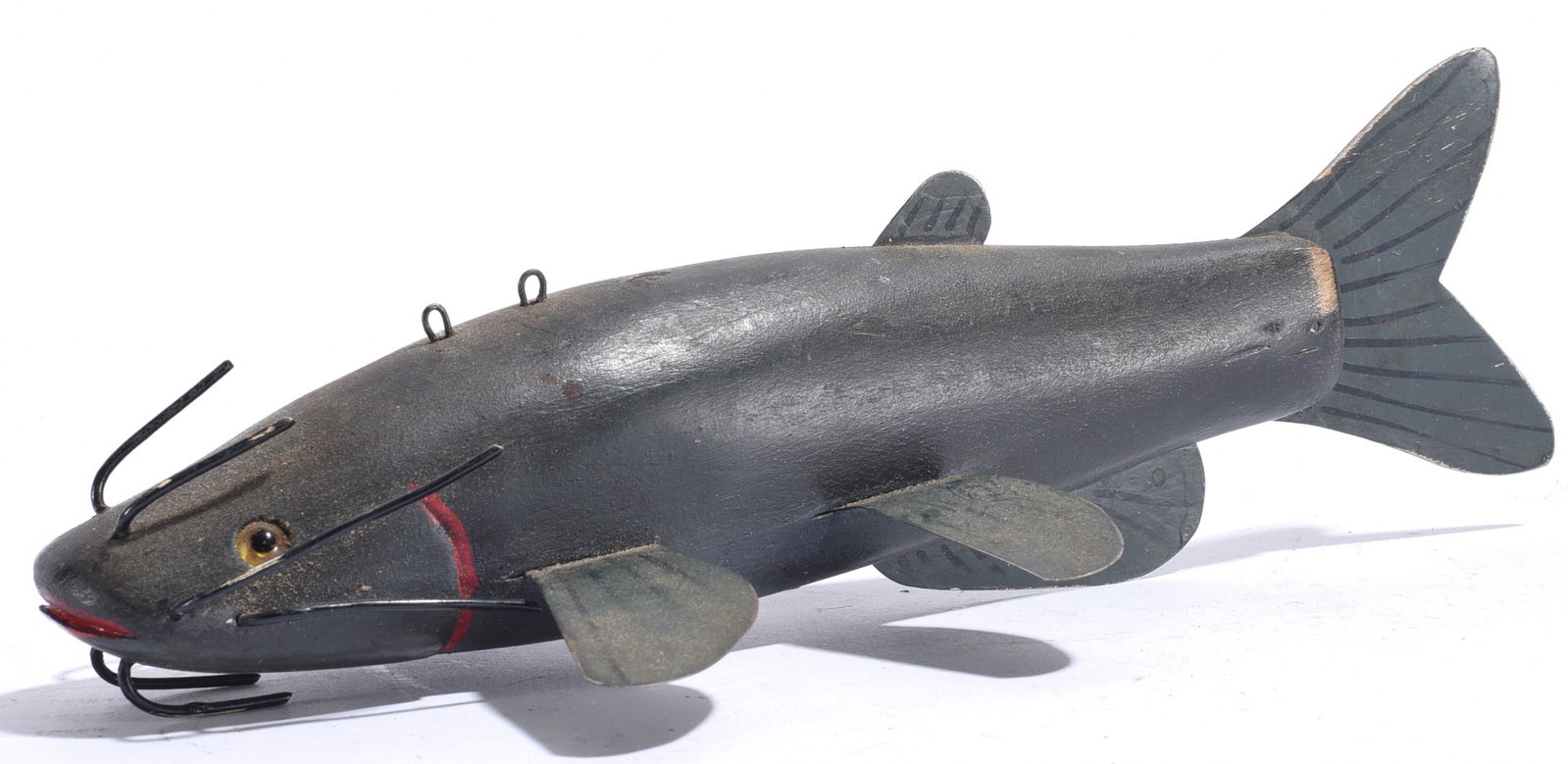 Vintage Carved Catfish Decoy: 9"x3" Vintage carved and painted catfish decoy with dark gray finish, applied metal fins, inset eyes, hanging loops and prominent wire whiskers.