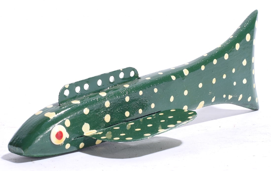 Vintage Carved Fish Decoy: 7"x2" Vintage carved and painted wooden fish decoy in dark green with cream-colored spotted decoration, applied fins, inset eye and perforated dorsal fin.