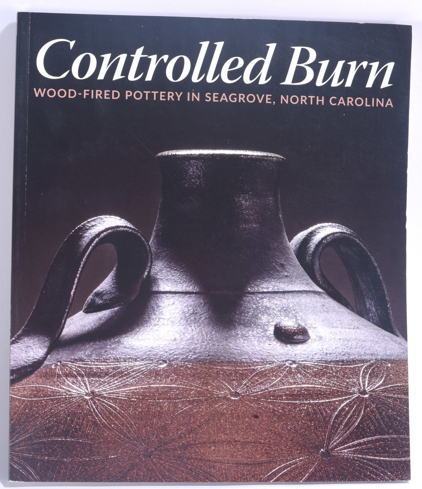Controlled Burn Pottery Reference Book: 9"x11" "Controlled Burn: Wood-Fired Pottery in Seagrove, North Carolina." Illustrated pottery reference book devoted to the wood-fired pottery tradition and contemporary potters of the Seagrove area.