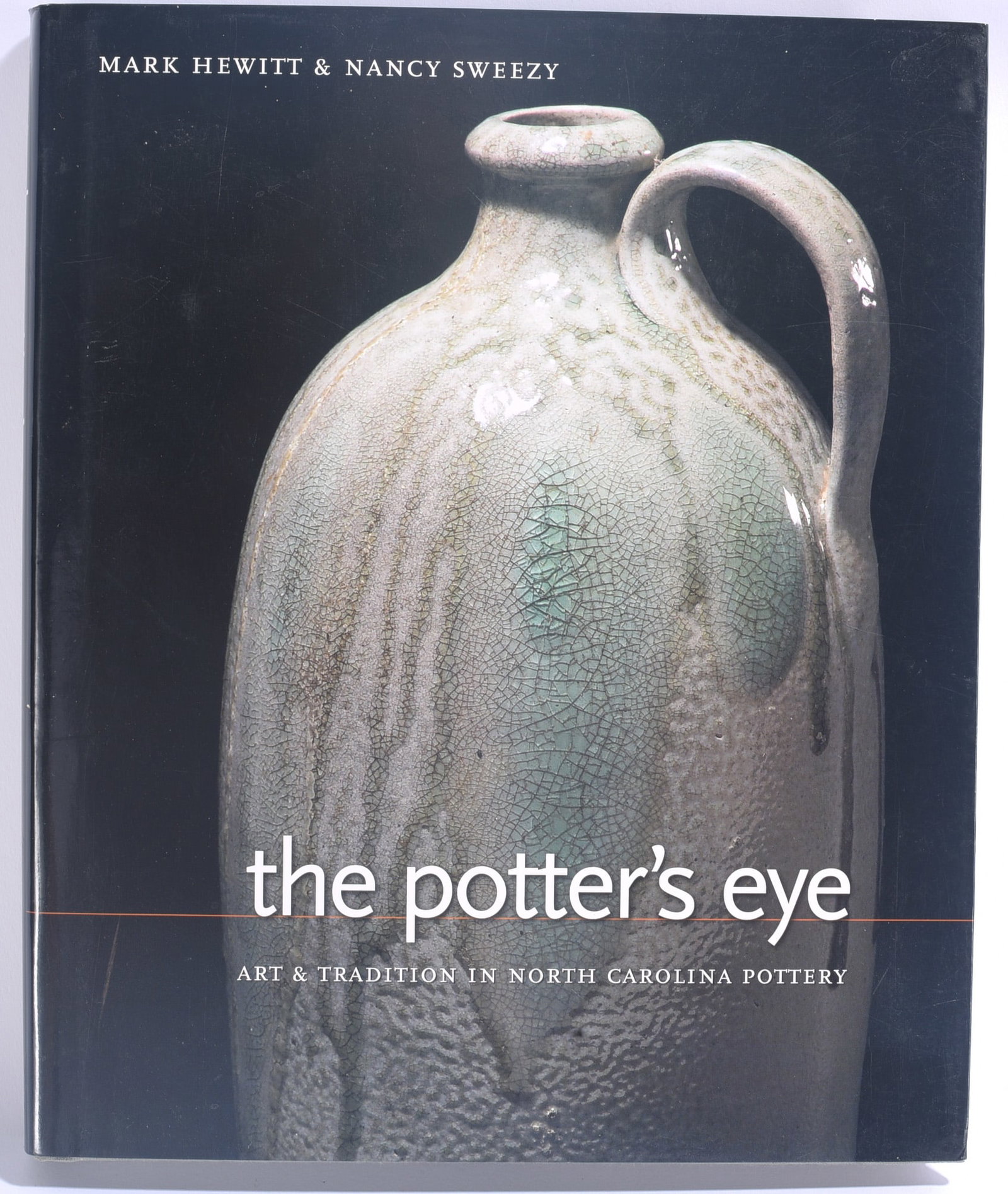 The Potter's Eye Pottery Reference Book: 10"x12" "The Potter's Eye: Art & Tradition in North Carolina Pottery" by Mark Hewitt and Nancy Sweezy. Illustrated reference book examining North Carolina pottery, its makers, forms and traditions.