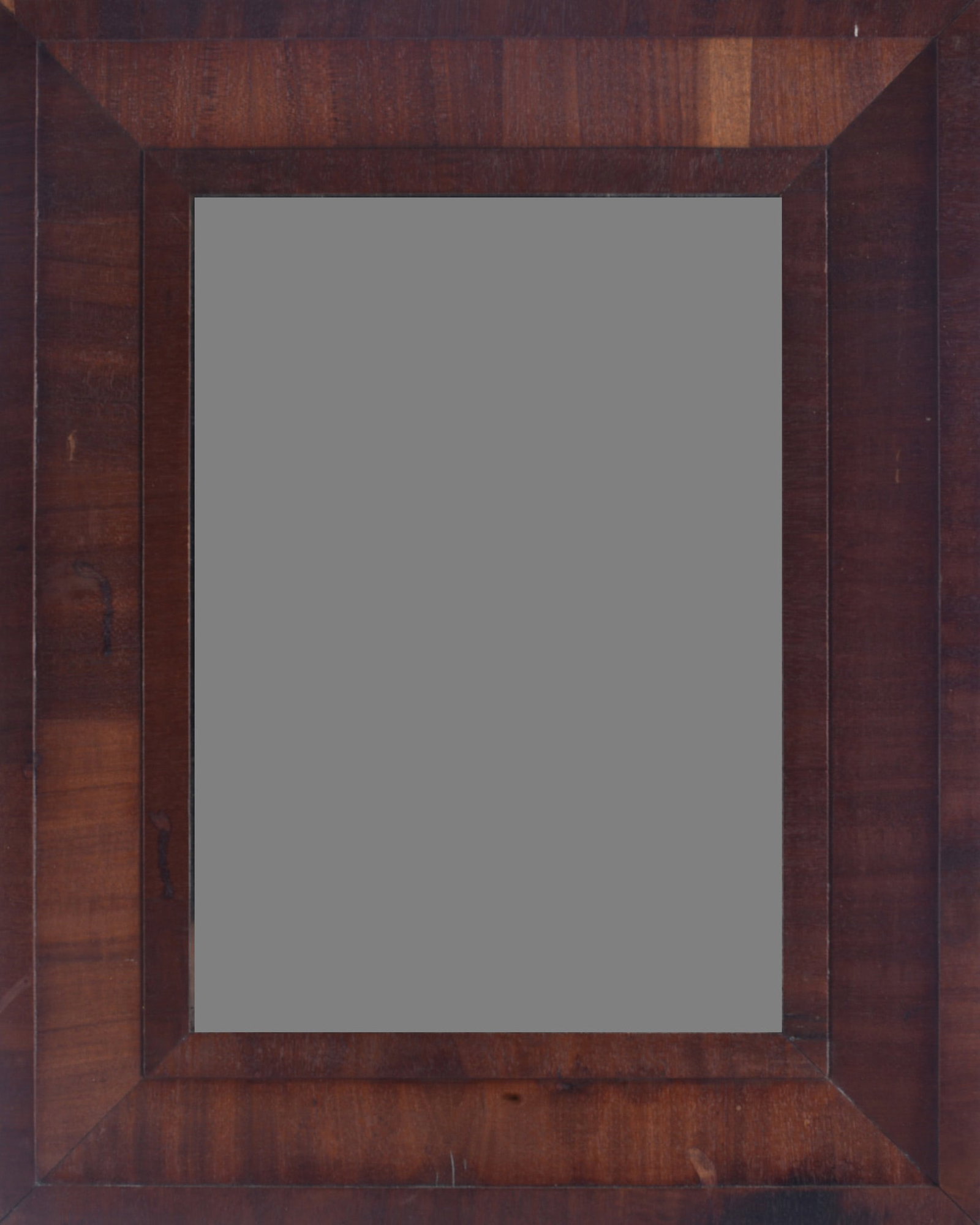 Antique OG Framed Mirror: 28"x16" Antique wooden ogee-style frame with rich dark finish and figured veneer construction; mirror or glass appears absent from the photographed opening.