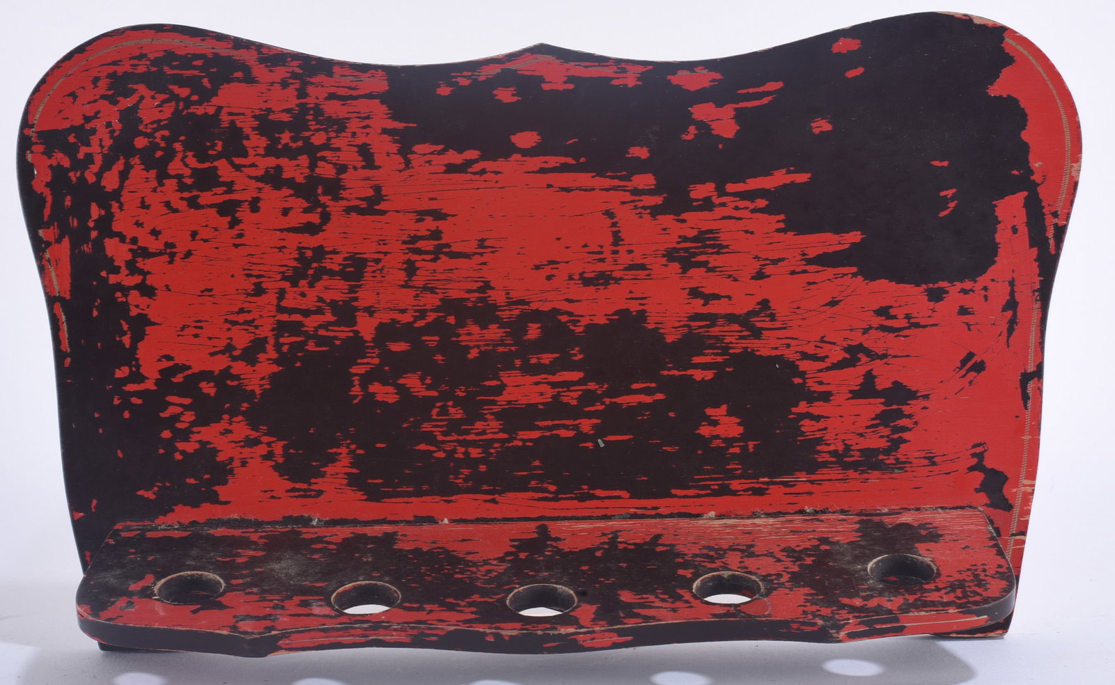 Antique Red Painted Wall Stand: 12"x7" Antique wall-mounted wooden stand or rack retaining distressed red and black painted surfaces with five circular openings along the lower shelf.