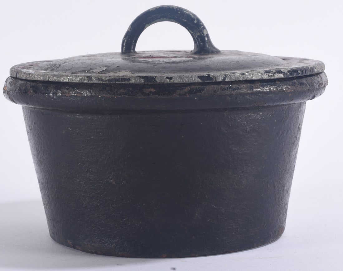 Antique Cast Iron Lidded Pot: 4" Antique cast iron lidded pot with fitted lid and arched handle, retaining a dark aged surface and signs of use.