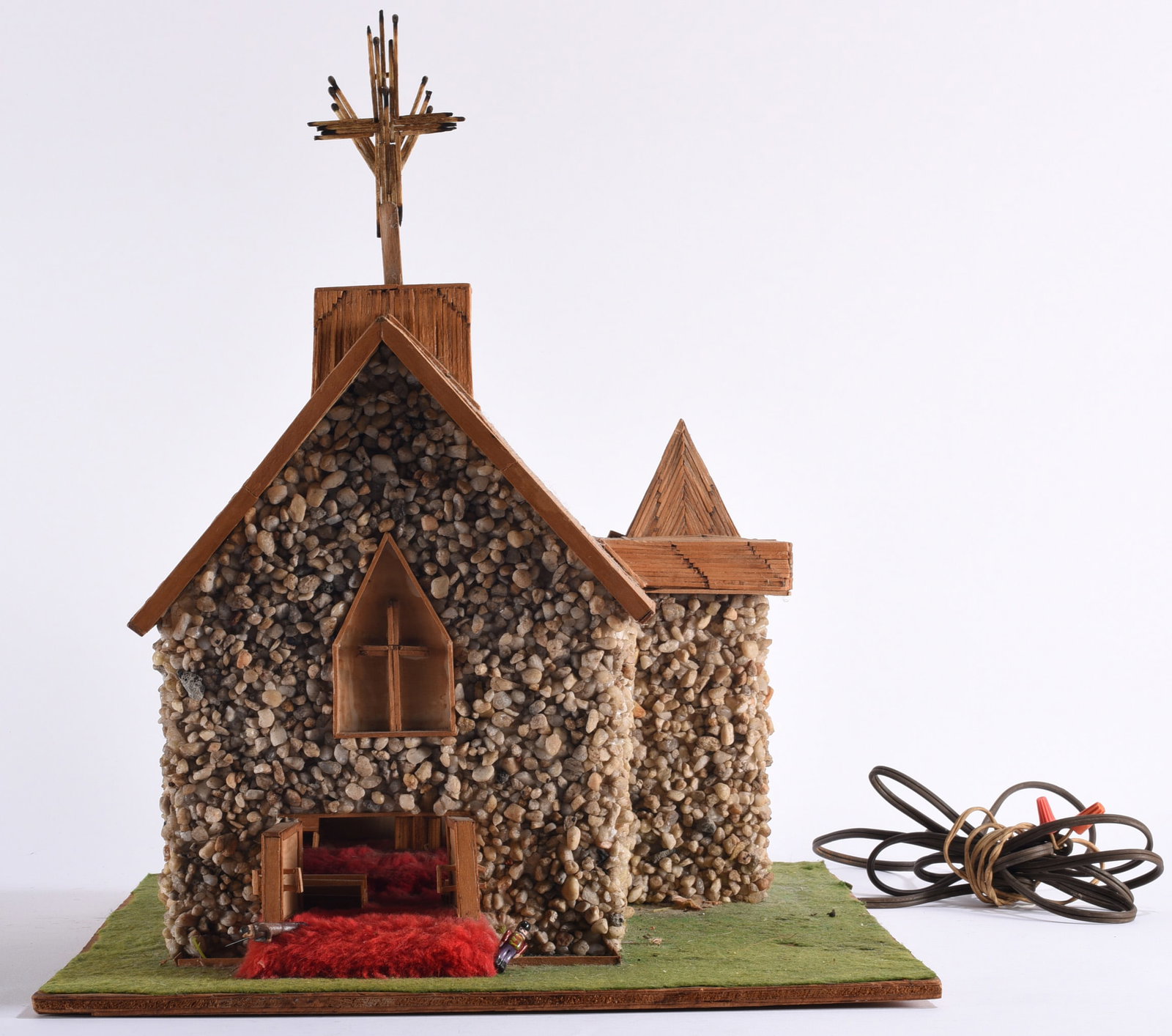 Folk Art Prison Made Matchstick Church Prison Art: 17"x18"x16" Folk art prison-made architectural model of a church, intricately constructed from matchsticks, wood, small stones, and other found materials. Features a stone-covered exterior, pitched